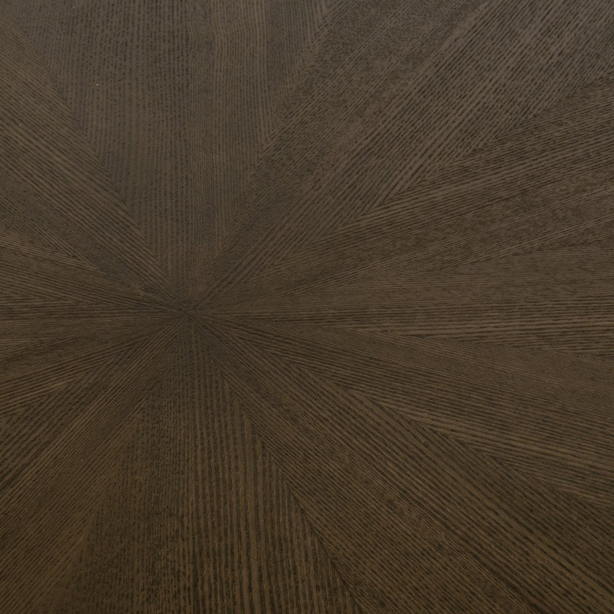 Close-up of the starburst pattern on the natural gray ash wood tabletop of the Essentials for Living Coulter 54" round table