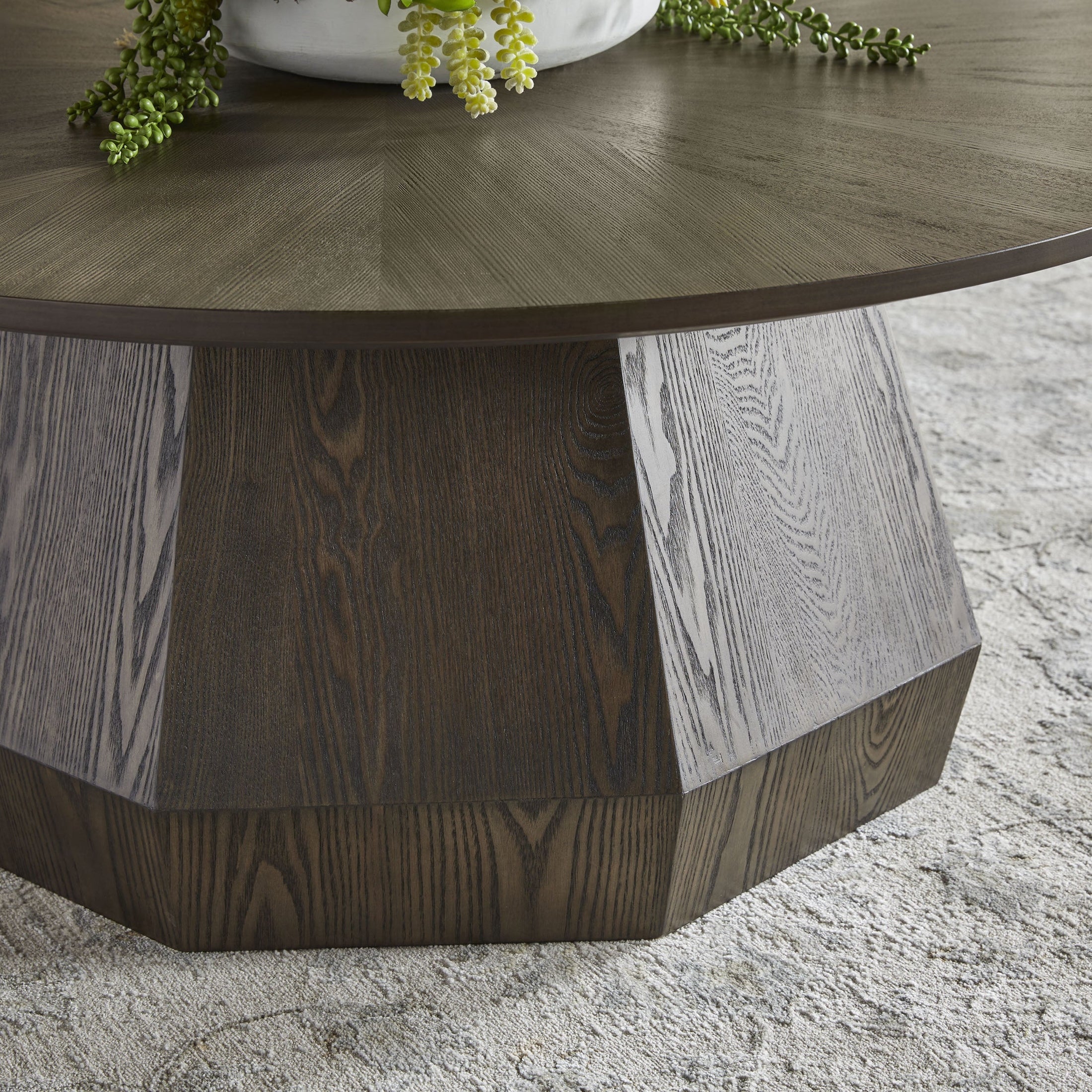Close-up of Essentials For Living Coulter Coffee Table with burnished brown ash veneer and starburst tabletop pattern