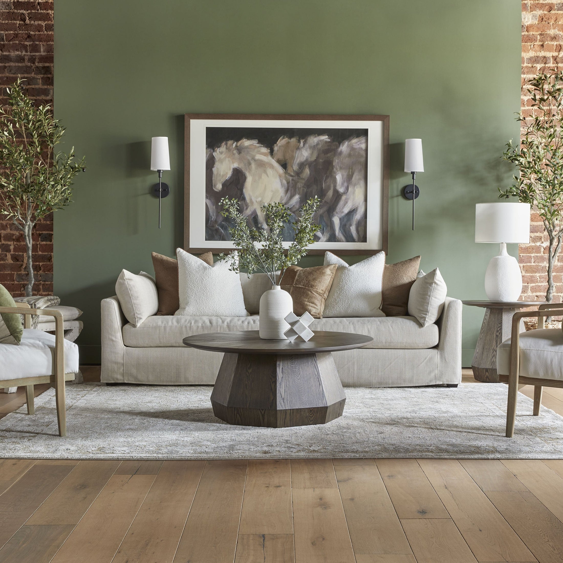 Essentials for Living Coulter Coffee Table with starburst top and octagon pedestal in warm brown ash veneer in a stylish living room.