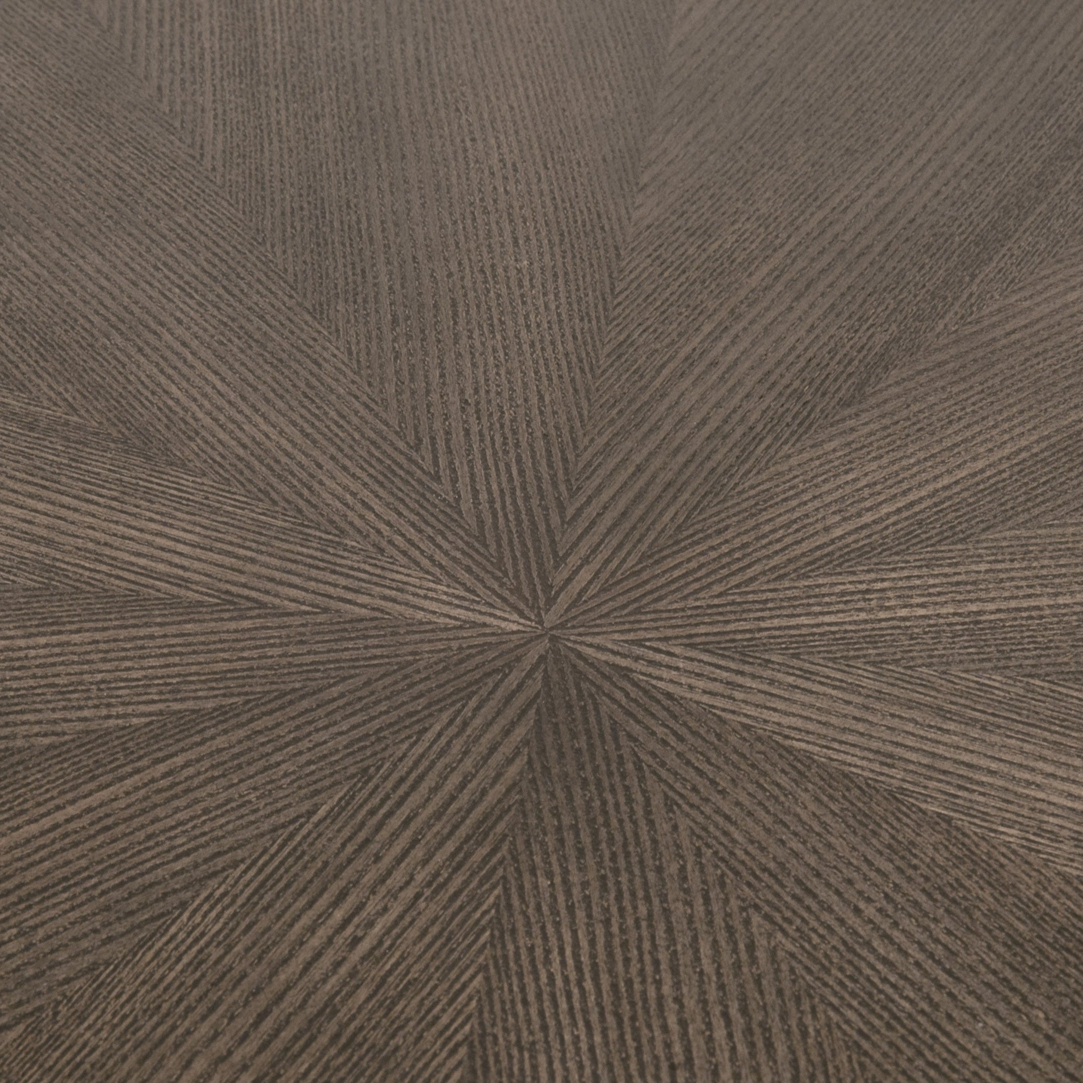 Close-up of the burnished brown ash veneer starburst pattern top on the Coulter End Table by Essentials For Living