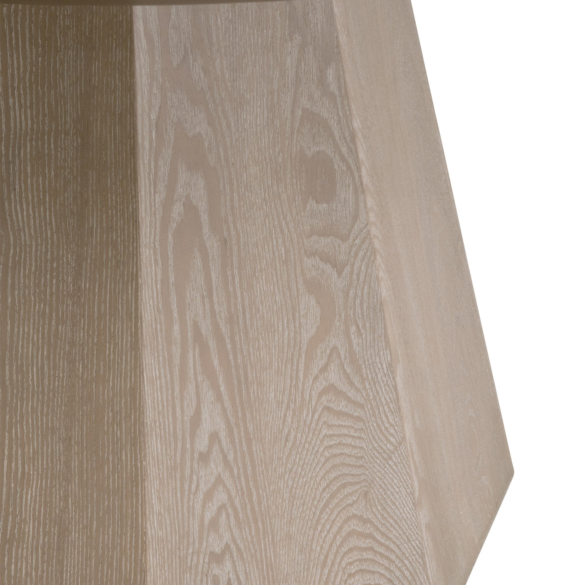 Close-up of natural gray ash wood grain on the octagon-shaped pedestal base of a round dining table