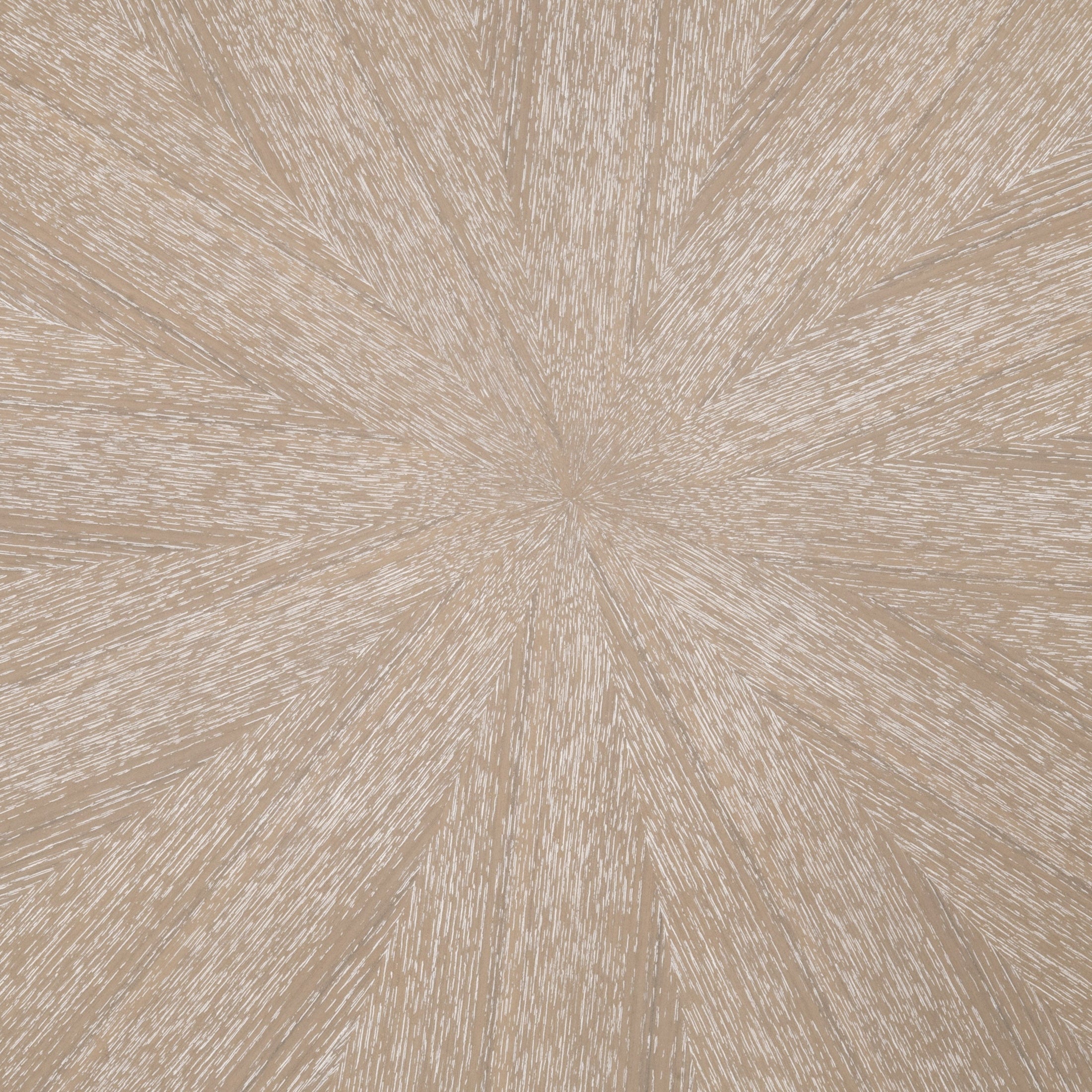 Close-up of the burnished brown ash veneer tabletop with an elegant starburst pattern and wire-brushed finish
