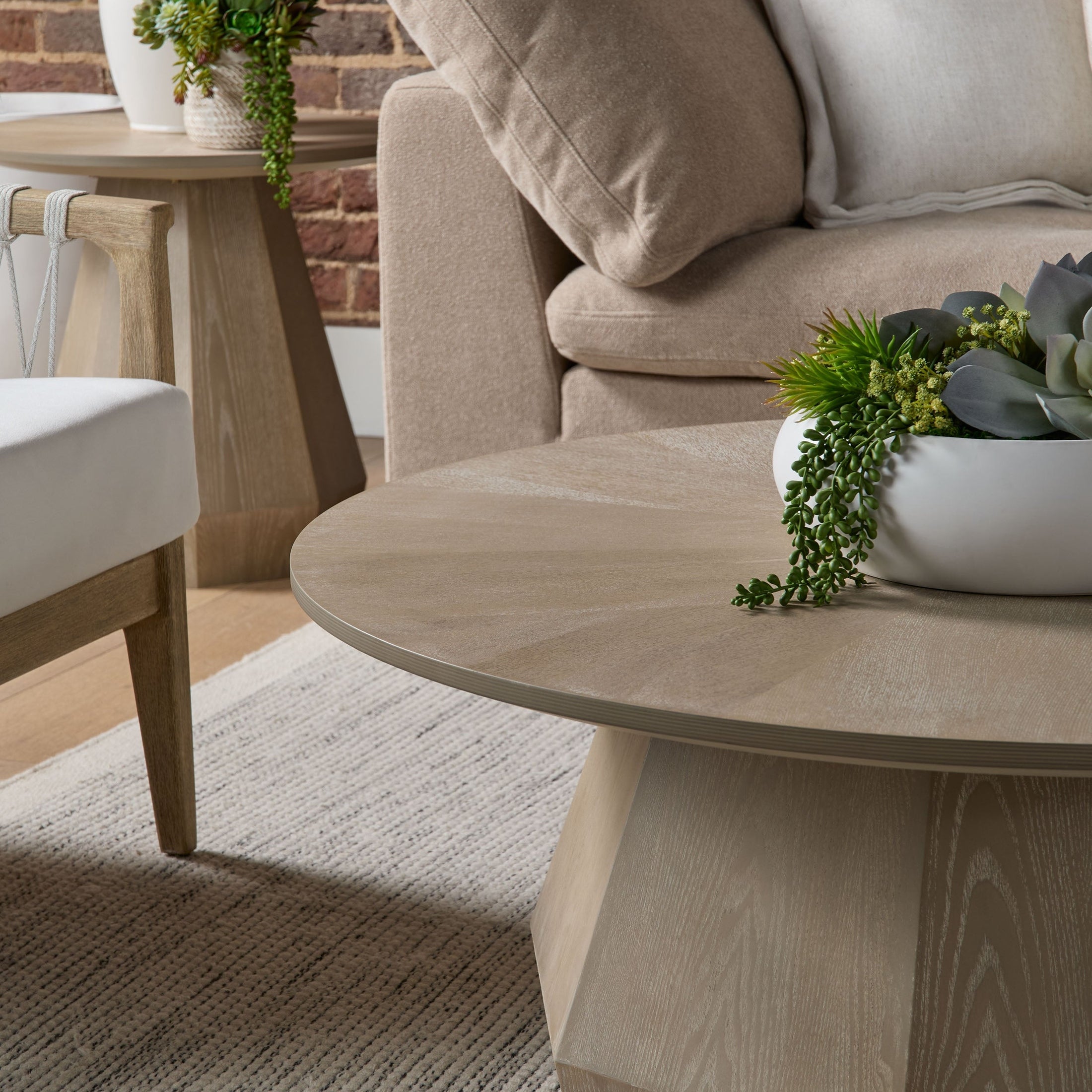 Essentials for Living Coulter Coffee Table with starburst wood grain and octagon pedestal in cozy living room setting
