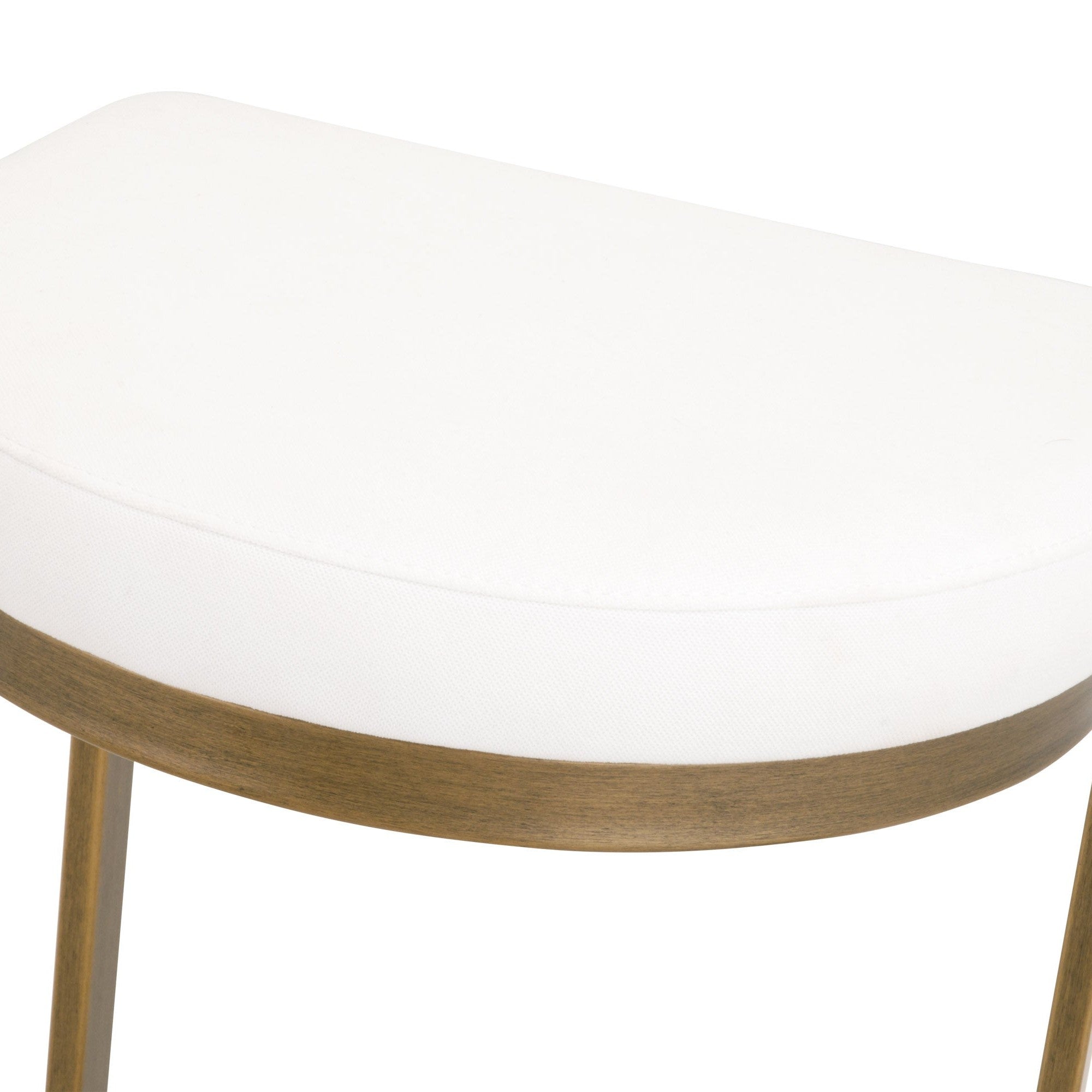 Close-up of Cresta Counter Stool’s white semicircle seat with brushed gold steel base by Essentials For Living