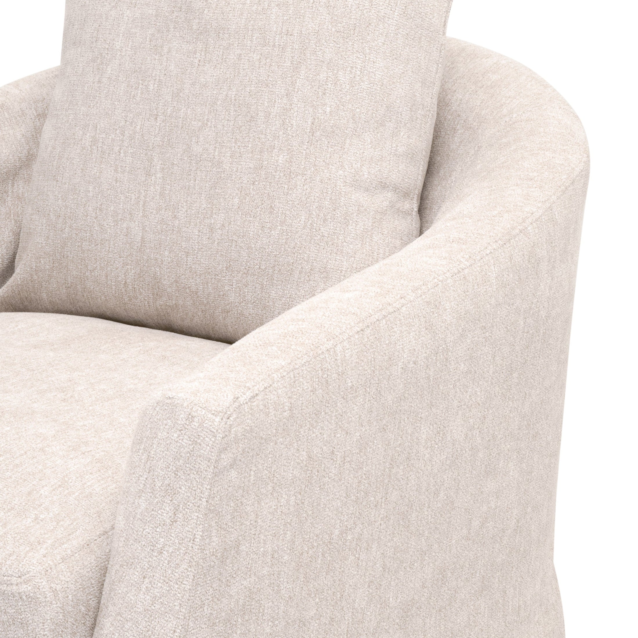 Close-up of a crème slipcover swivel club chair arm and cushion by Essentials for Living with soft textured fabric