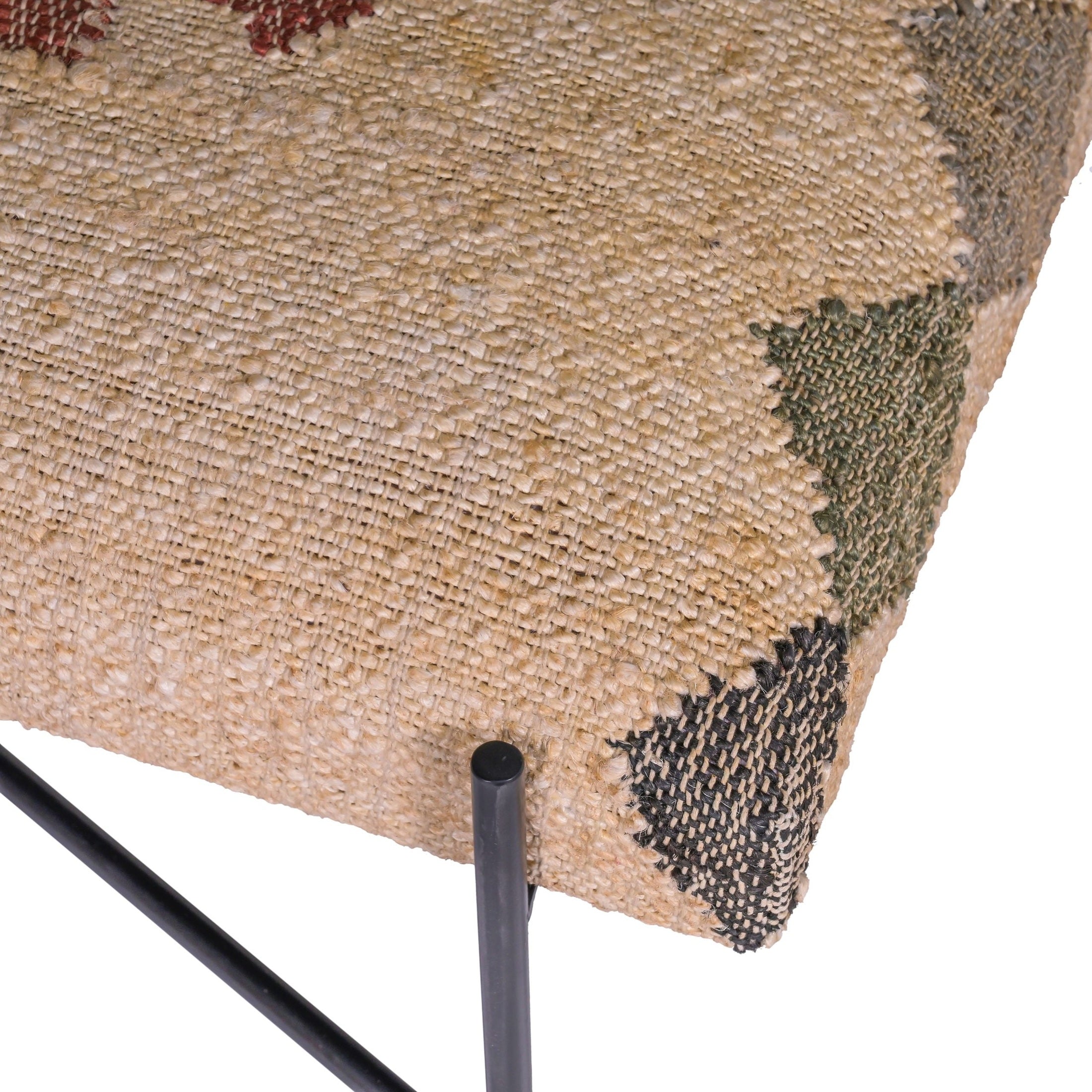 Close-up of multicolor woven upholstery and black iron X-base on GOODIE BENCH by GO HOME.