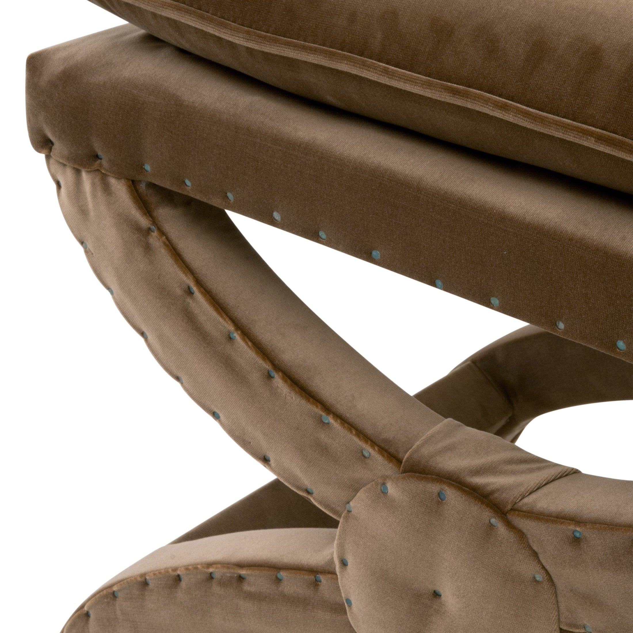 Close-up of plush curved ottoman legs with nailhead trim in soft brown fabric by Essentials For Living