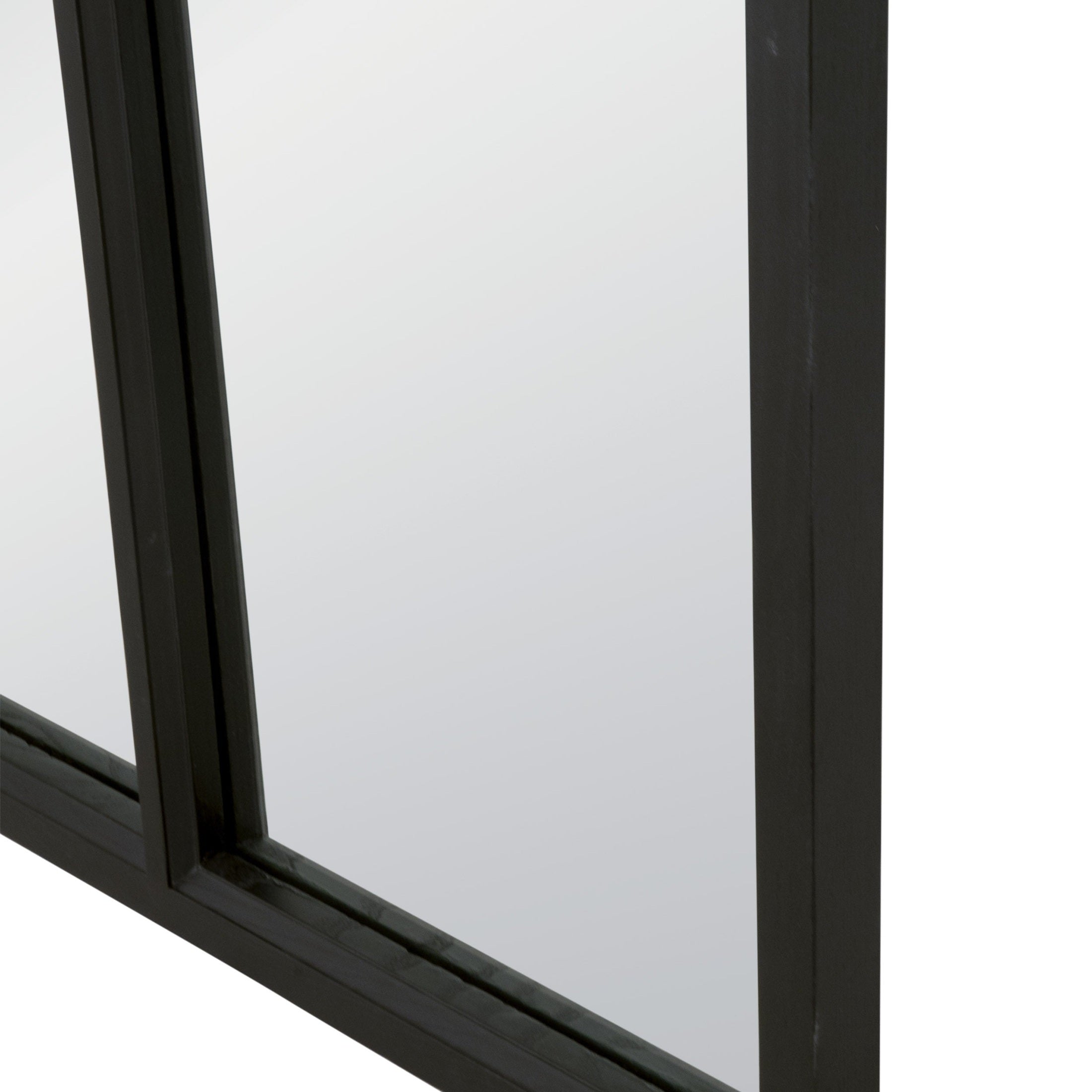 Close-up of the Grid Arched Mirror's black wood frame showcasing the sleek craftsman details and smooth glass surface.