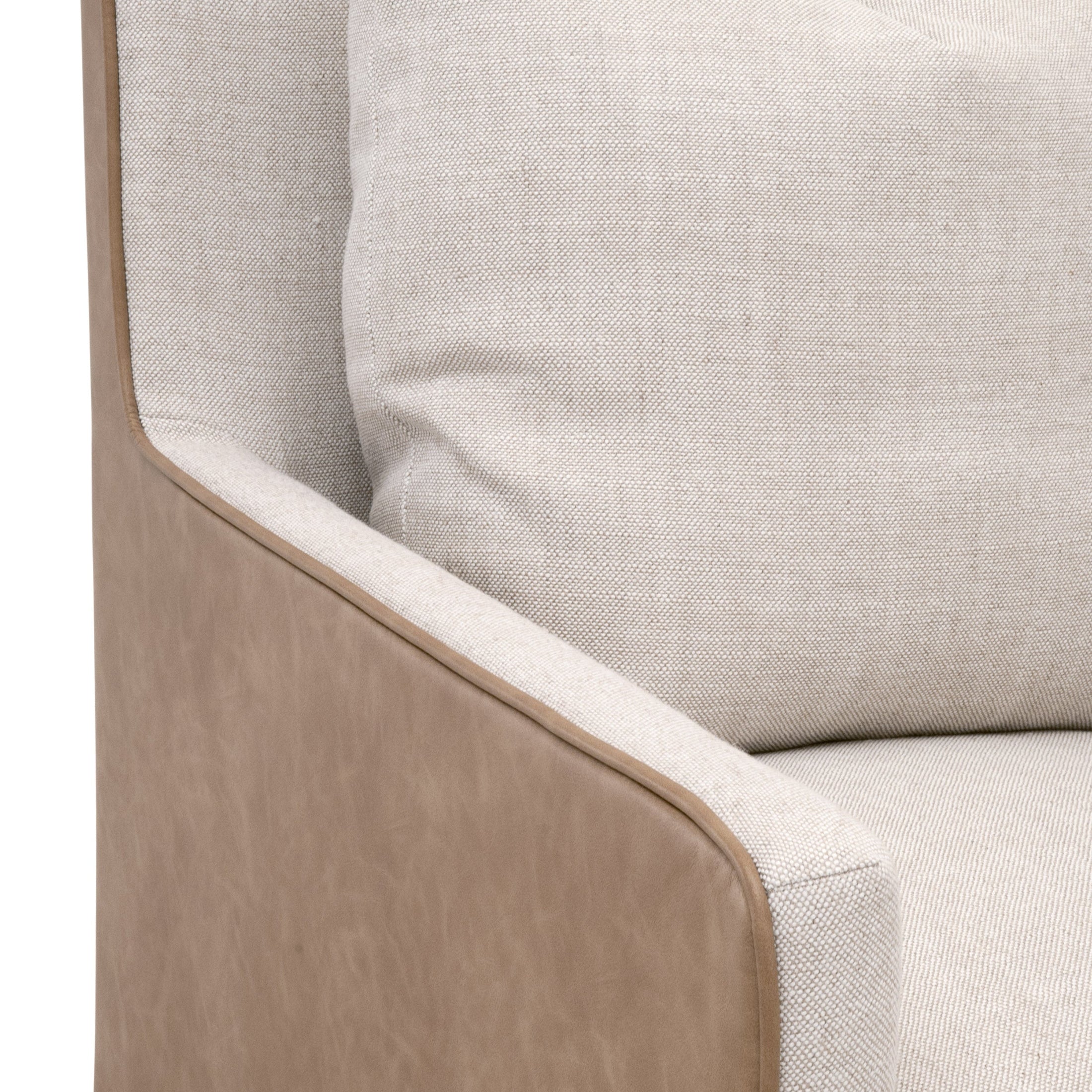 Close-up of Essentials for Living Harmony Arm Chair with casters featuring two-tone upholstery and a plush cushion