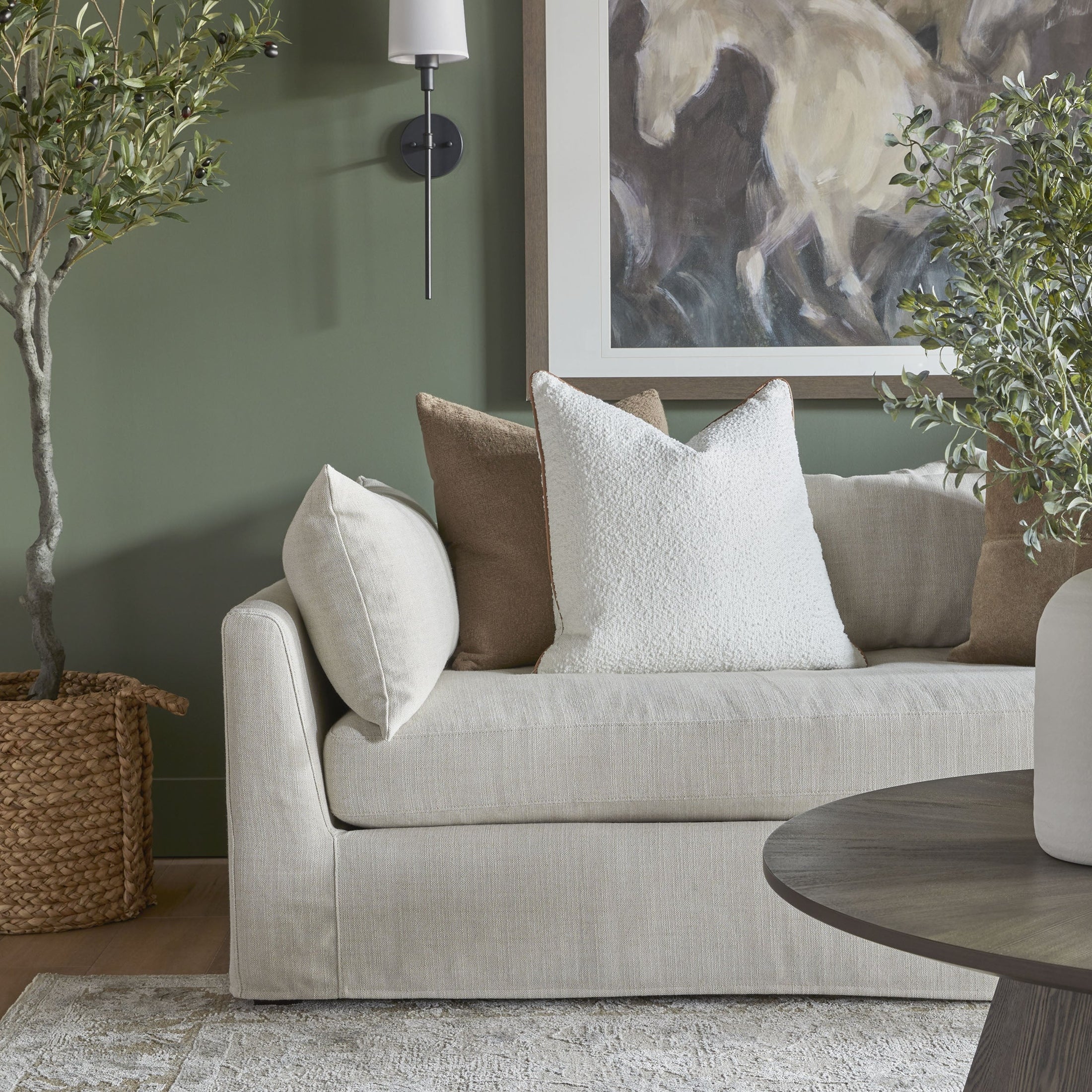 Haven 96" Lounge Slipcover Sofa in bisque linen blend with plush pillows in a cozy living room by Essentials for Living