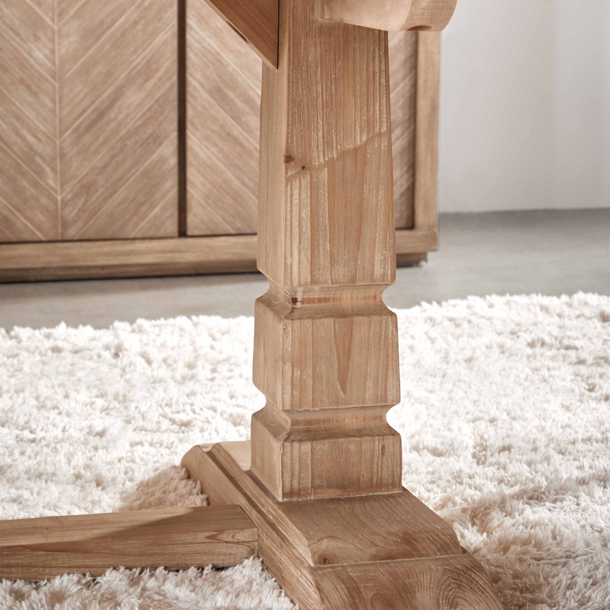 Close-up of trestle-style base of Hayes Extension Dining Table in reclaimed pine wood by Essentials for Living.