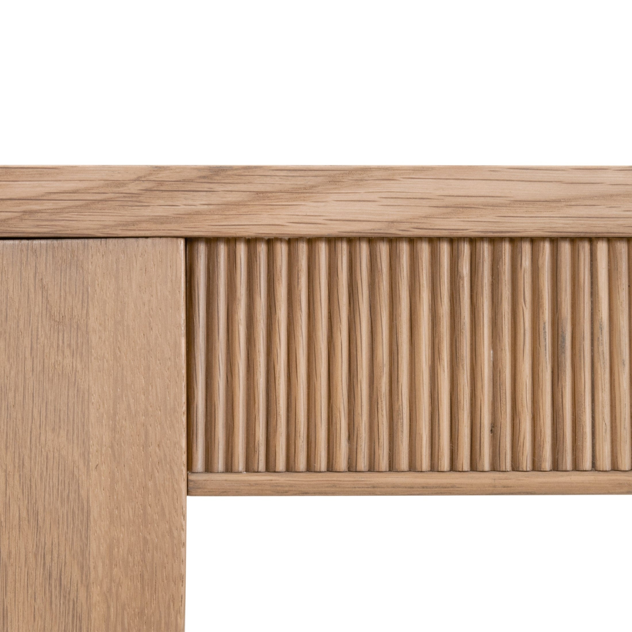 Close-up of fluted wood apron detail on Highland Extension Dining Table in natural oak by Essentials for Living