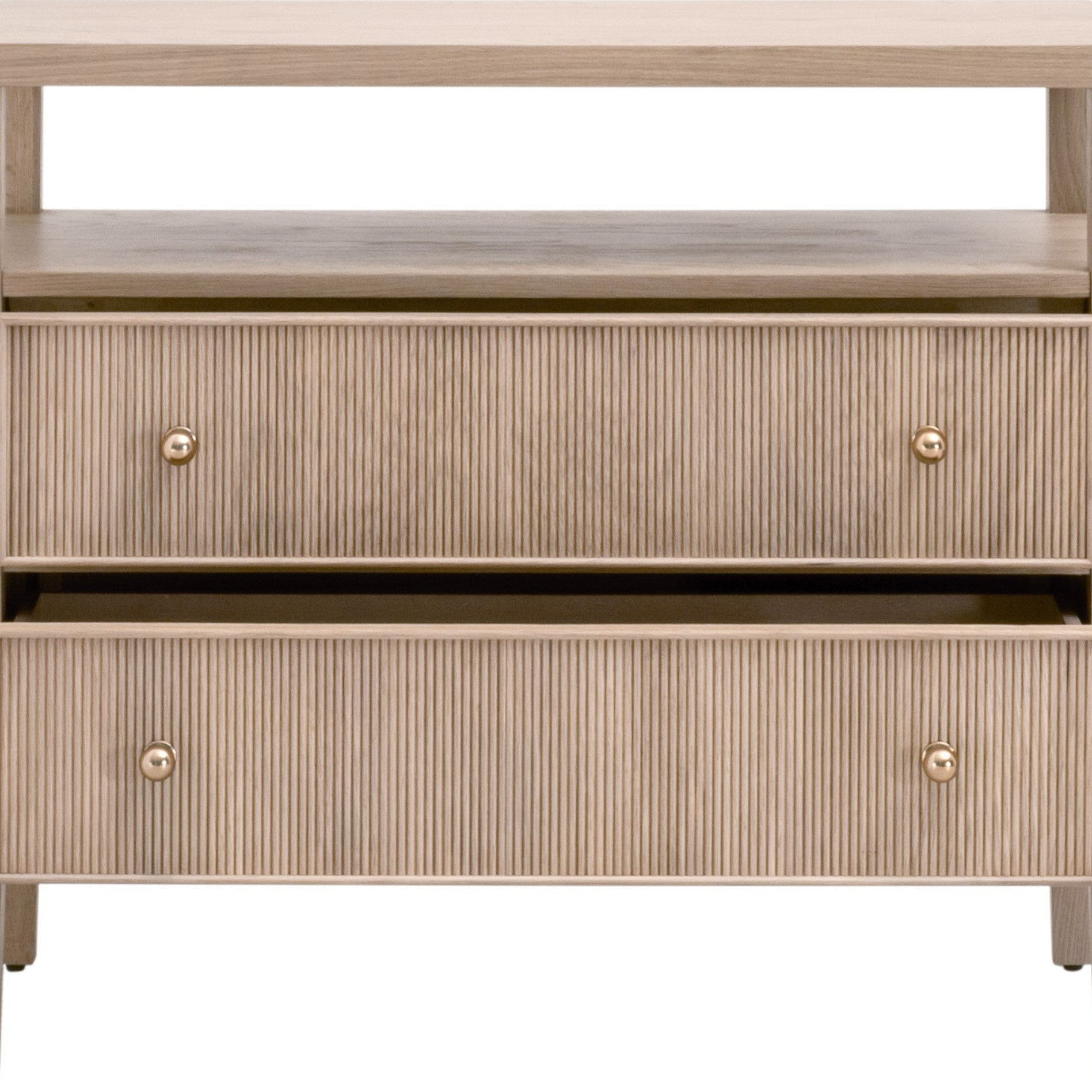 Close-up of beige wood nightstand with two fluted drawers and brass knobs from Essentials For Living collection.