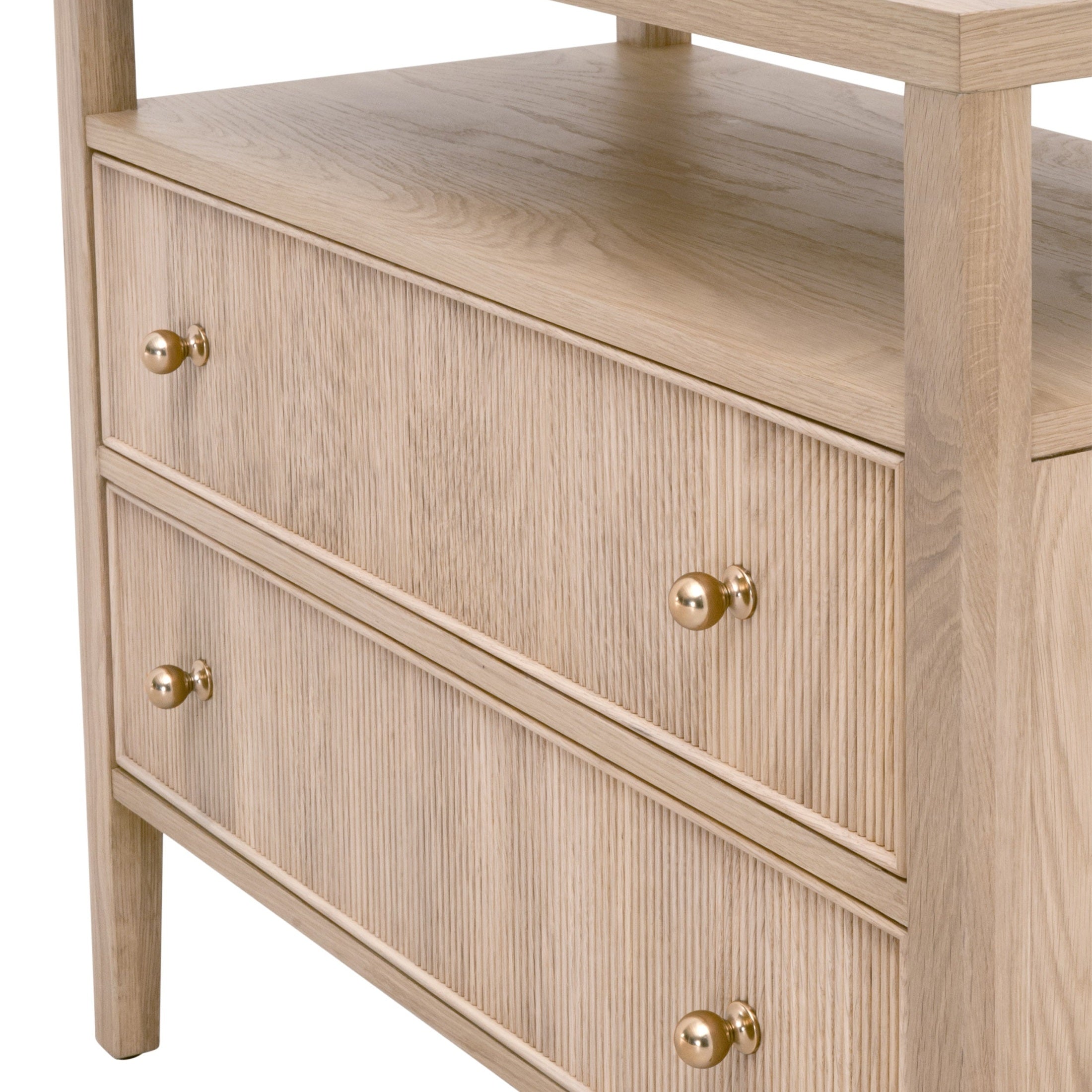 Close-up of light oak nightstand with two fluted front drawers and brass knobs by Essentials for Living