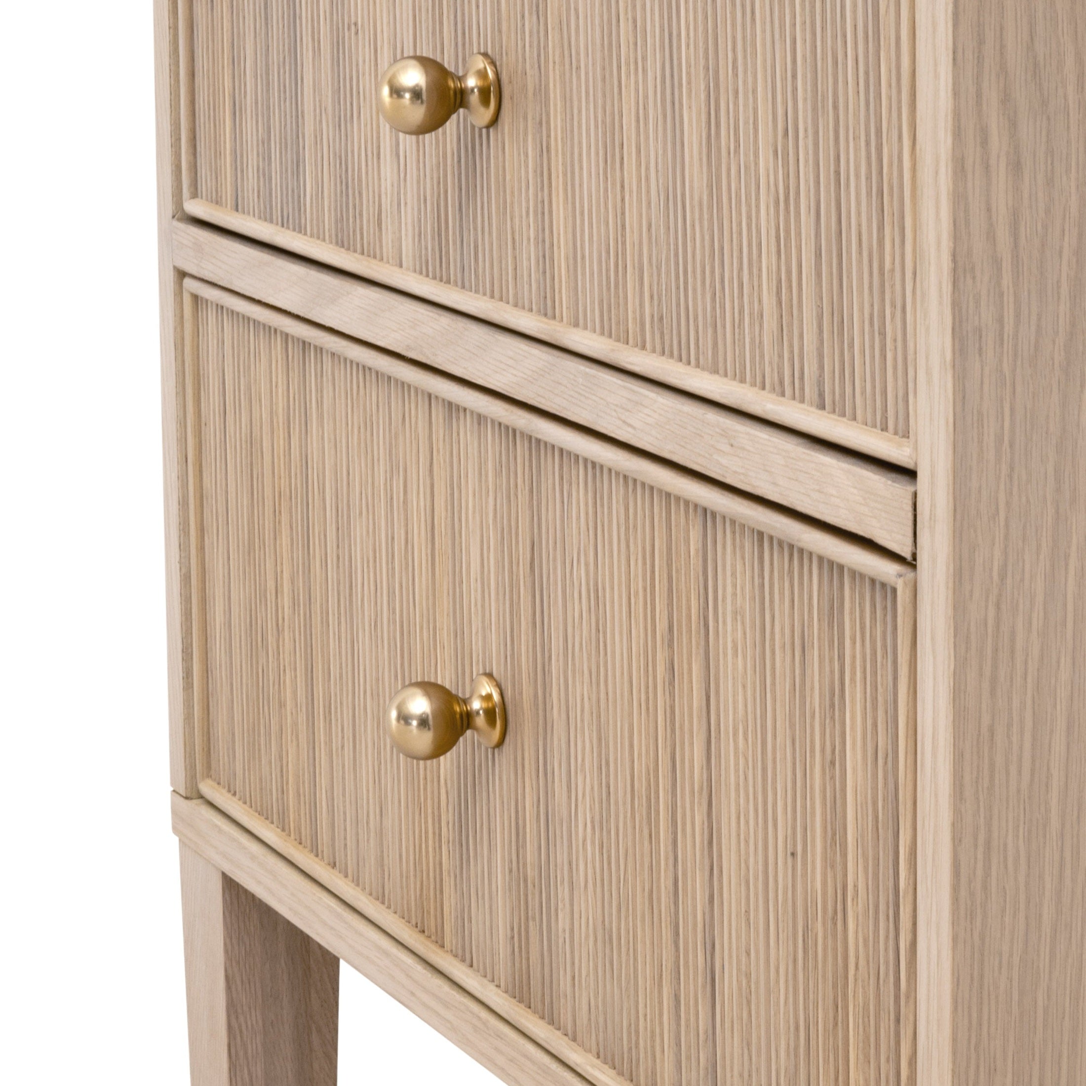 Close-up of Highland 2-drawer nightstand with fluted oak wood texture and polished brass knobs by Essentials for Living