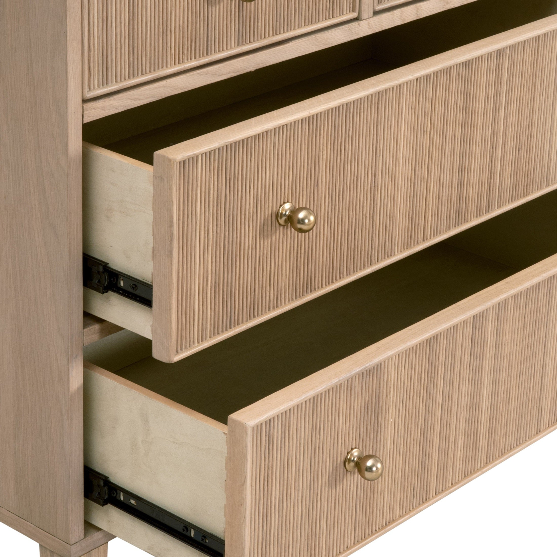 Close-up of Highland 8-Drawer Double Dresser with fluted oak wood fronts and polished brass knobs by Essentials For Living