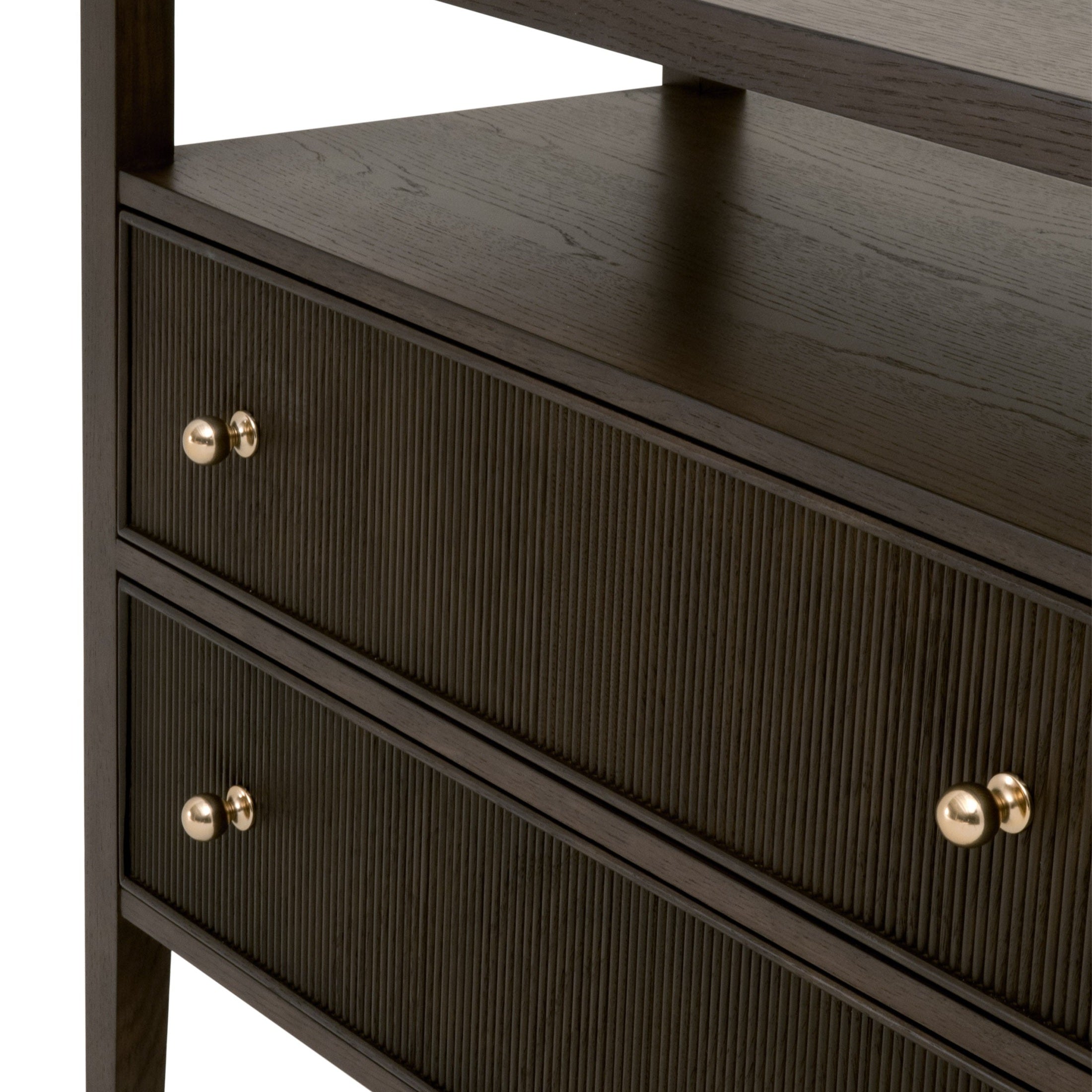 Close-up of a rich Dutch Brown Oak nightstand with two fluted wood front drawers and polished brass knobs by Essentials For Living.