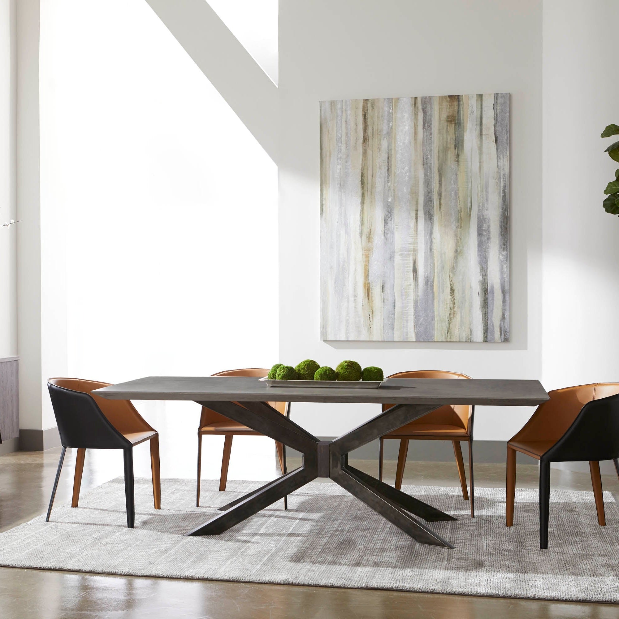 Industry Rectangle Dining Table by Essentials For Living with ash gray concrete top and black iron base seating eight.