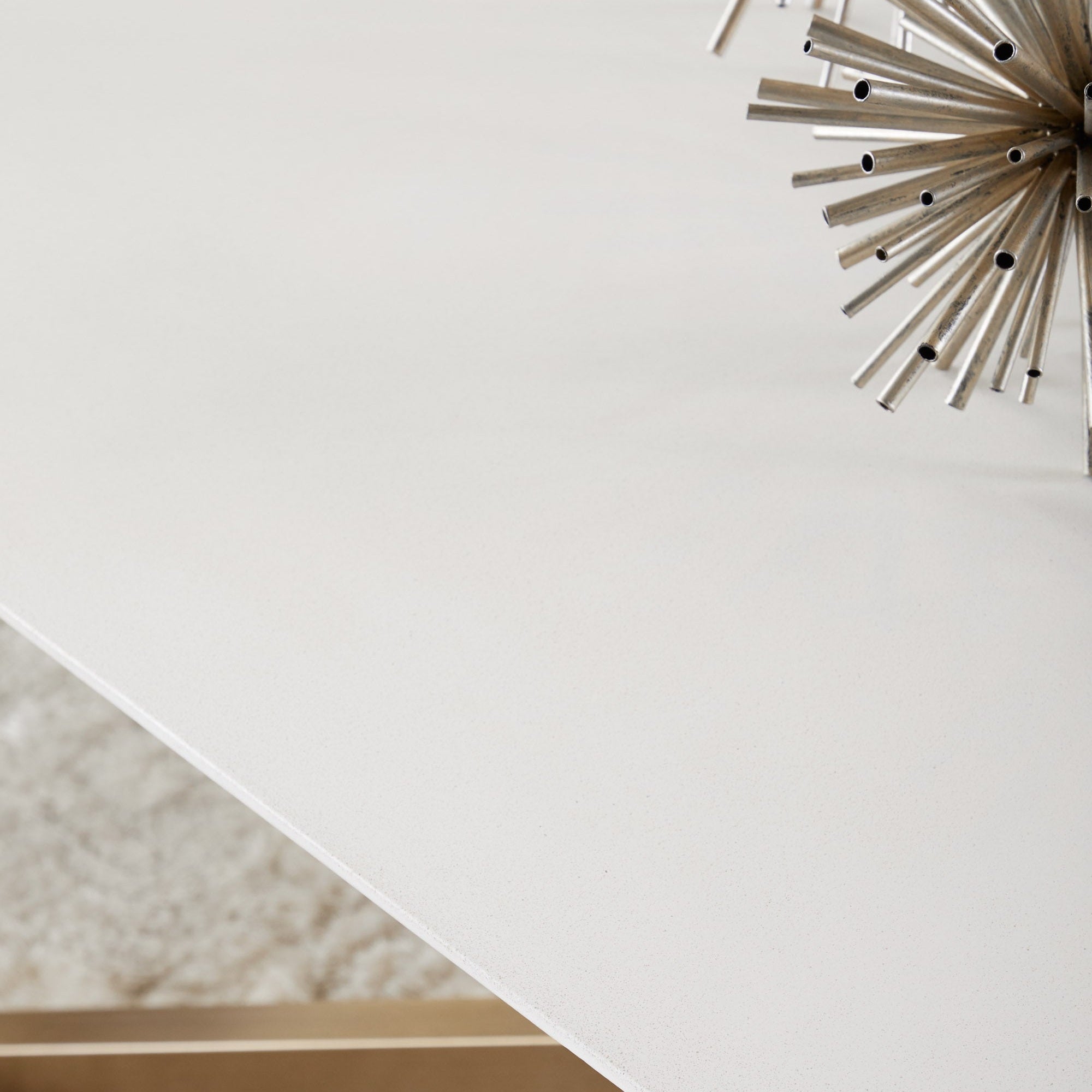 Close-up of a nano-sealed ash gray concrete tabletop with angled edges from Essentials For Living dining table