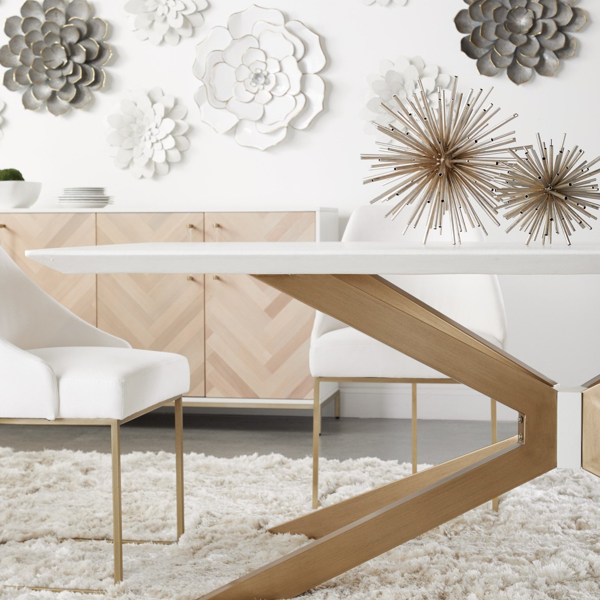 Essentials For Living Industry Rectangle Dining Table with a white top and unique angular wooden base in modern dining room setting