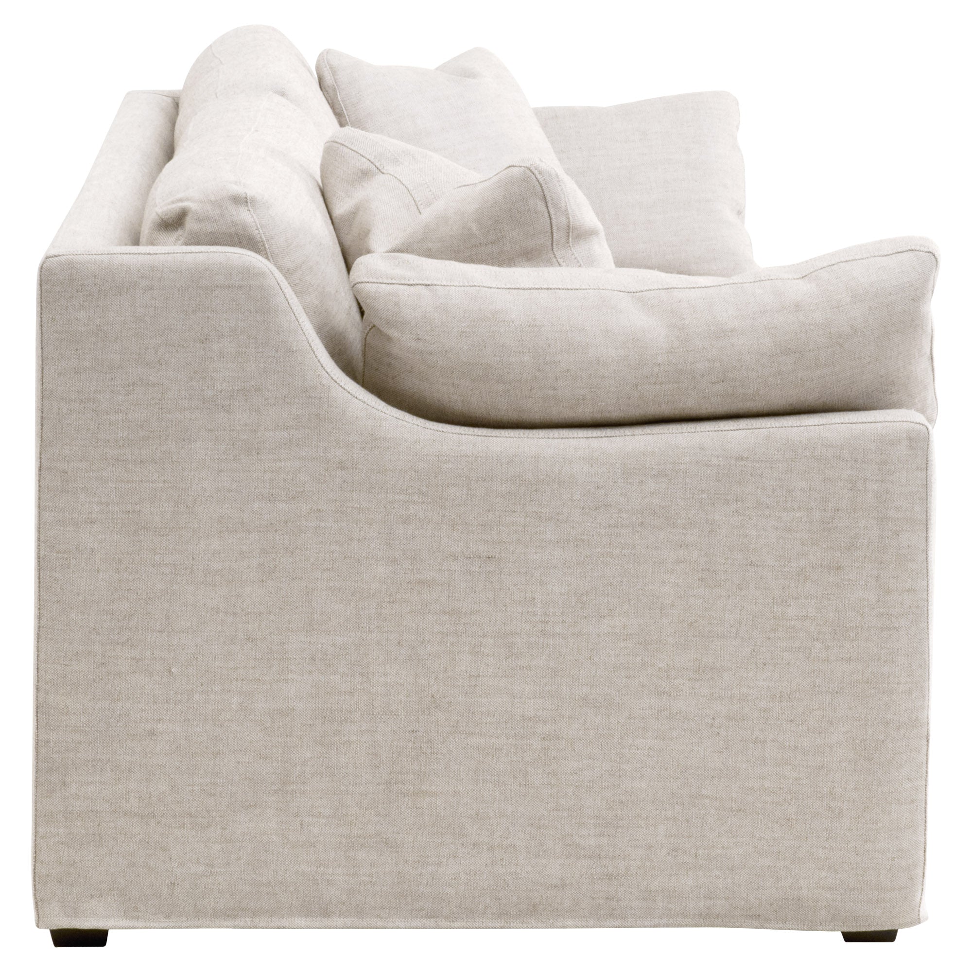 Side view of Lena 95" Slope Arm Slipcover Sofa in light beige linen fabric by Essentials for Living.
