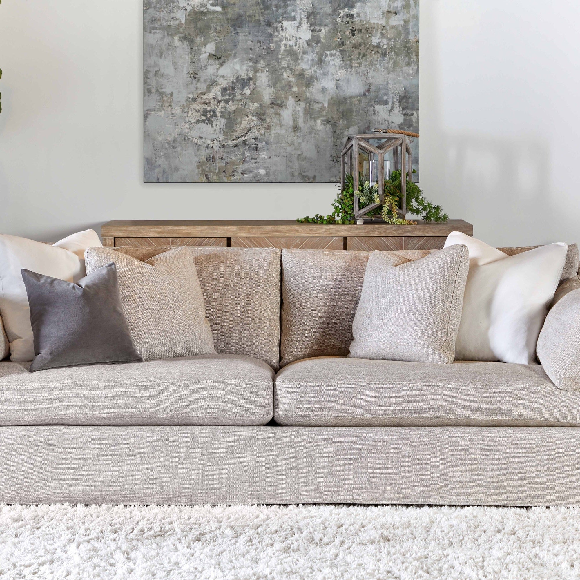 Lena 95" Slope Arm Slipcover Sofa in light beige linen-blend with pillows and espresso wood feet by Essentials for Living