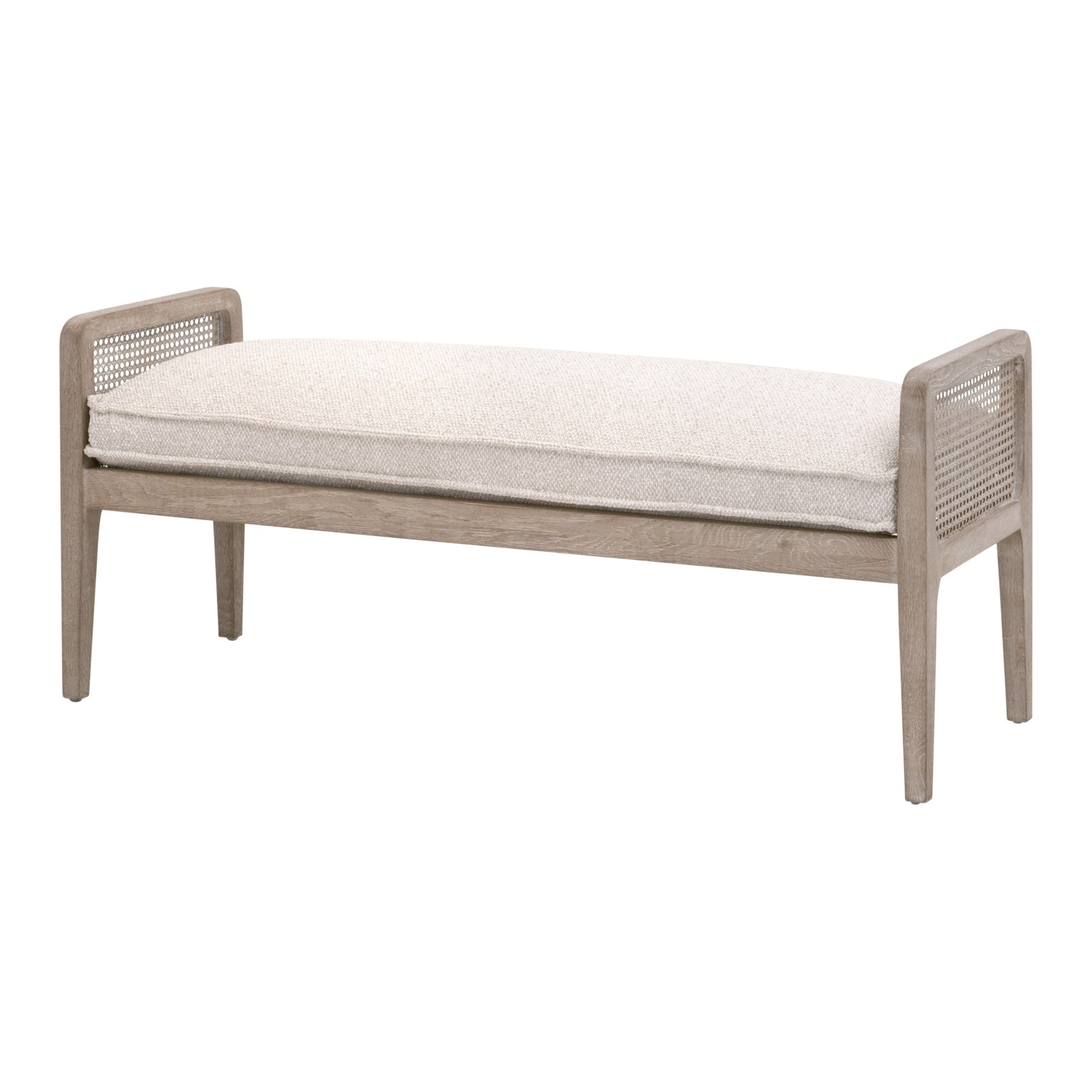 Essentials for Living Leone Bench with natural gray oak frame, cane sides, and cushioned seat in neutral fabric.