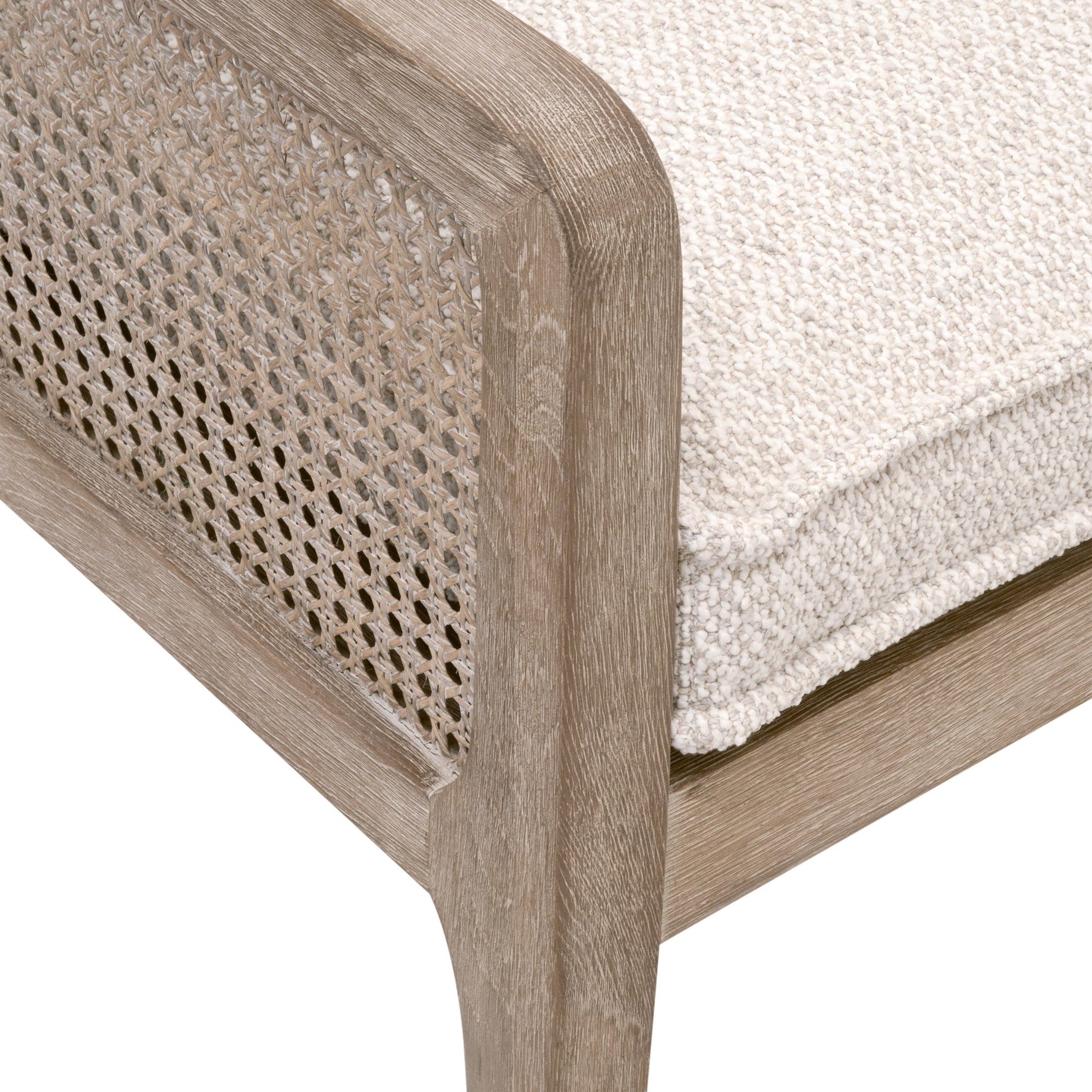 Close-up of Leone Bench corner showing natural gray oak frame with cane inlay and textured cream cushion fabric