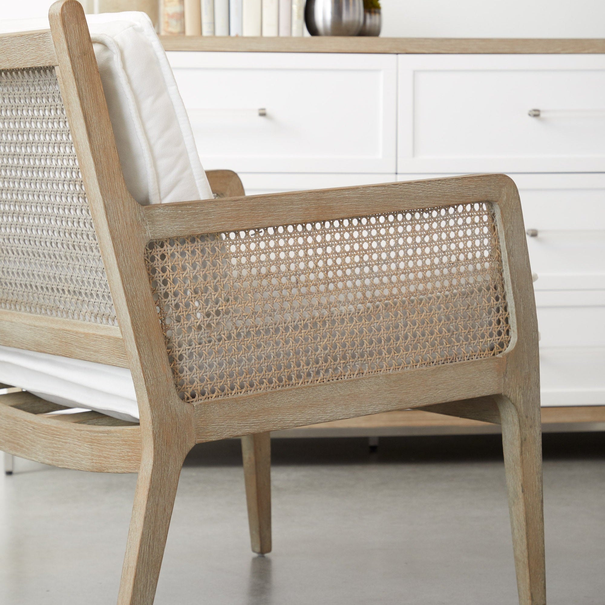 Essentials For Living Leone Club Chair with natural gray oak frame and handwoven cane detailing in a bright living space