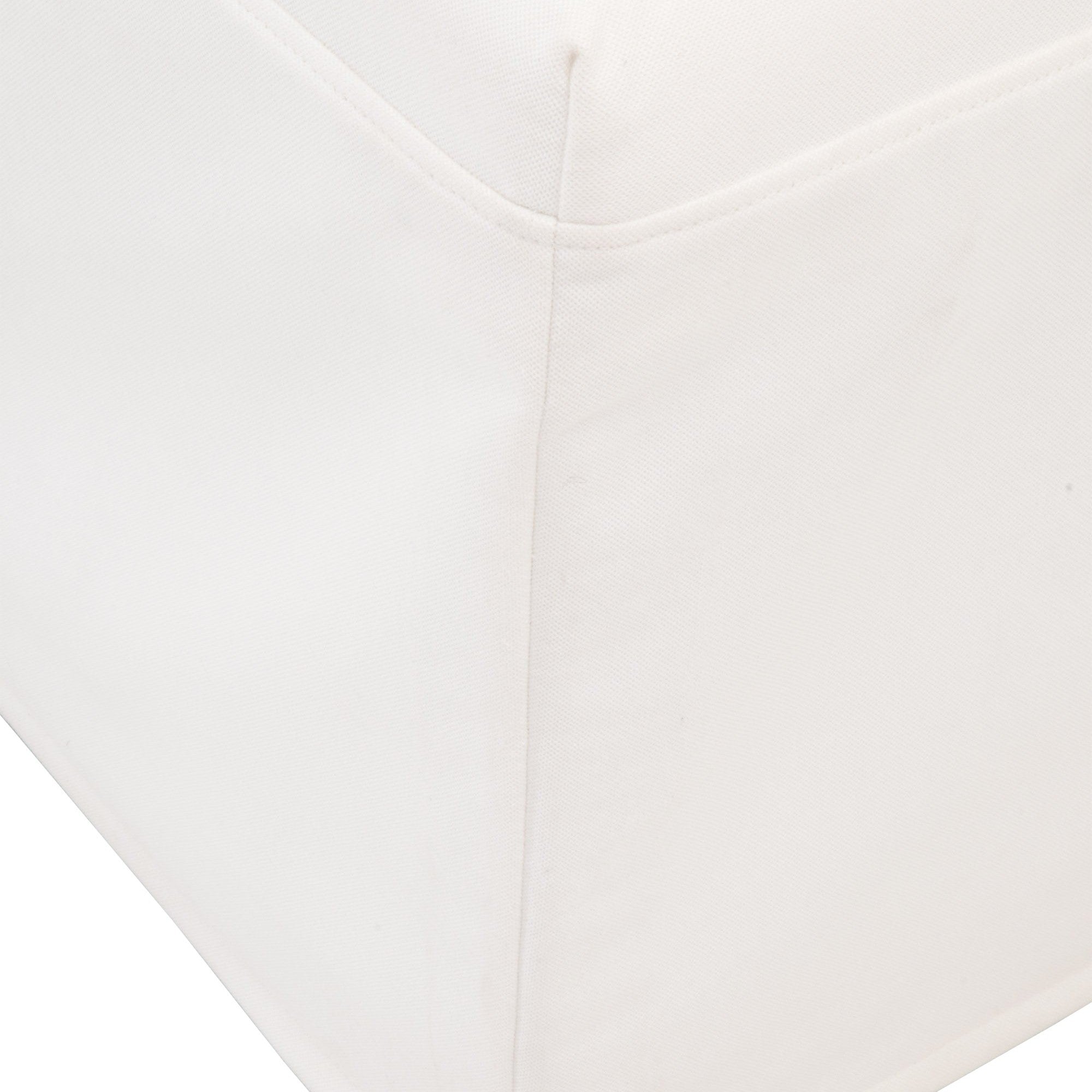 Close-up of the clean, tailored corner detail of the Levi Slipcover Dining Chair in neutral fabric by Essentials For Living