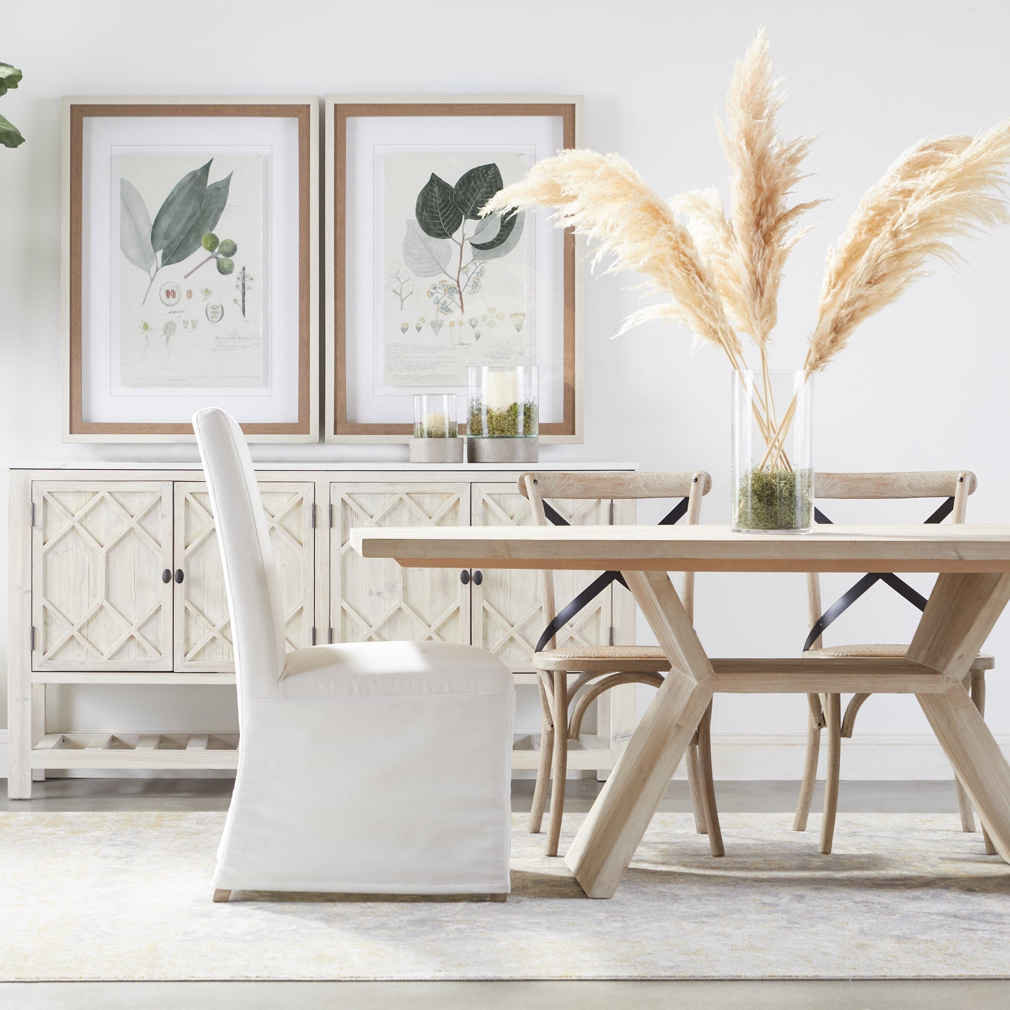 Essentials For Living Levi Slipcover Dining Chair set in neutral fabric with birch wood base in a bright dining room setting