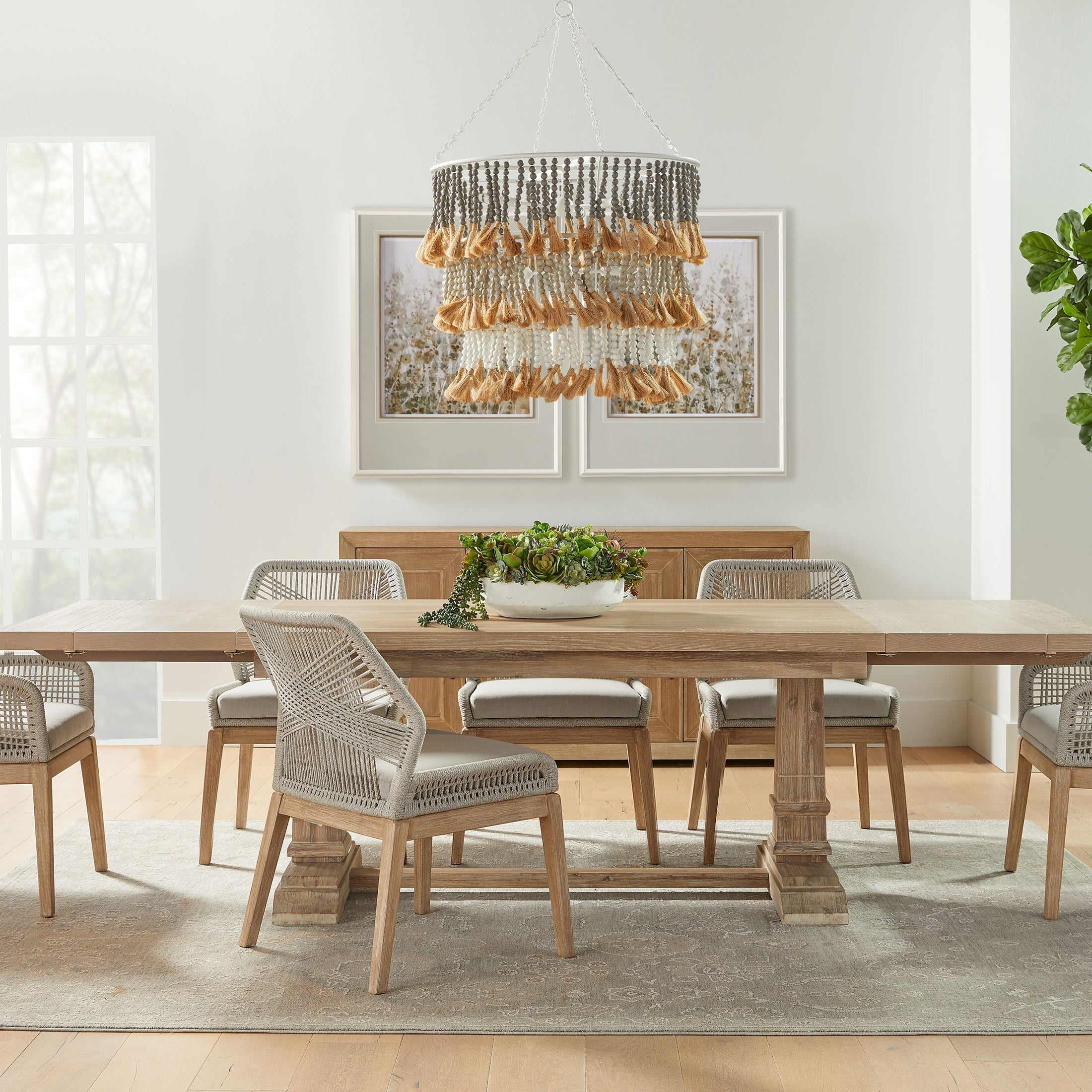 Essentials for Living Loom Dining Chairs with handwoven taupe and white rope and distressed gray wood legs in a modern dining room