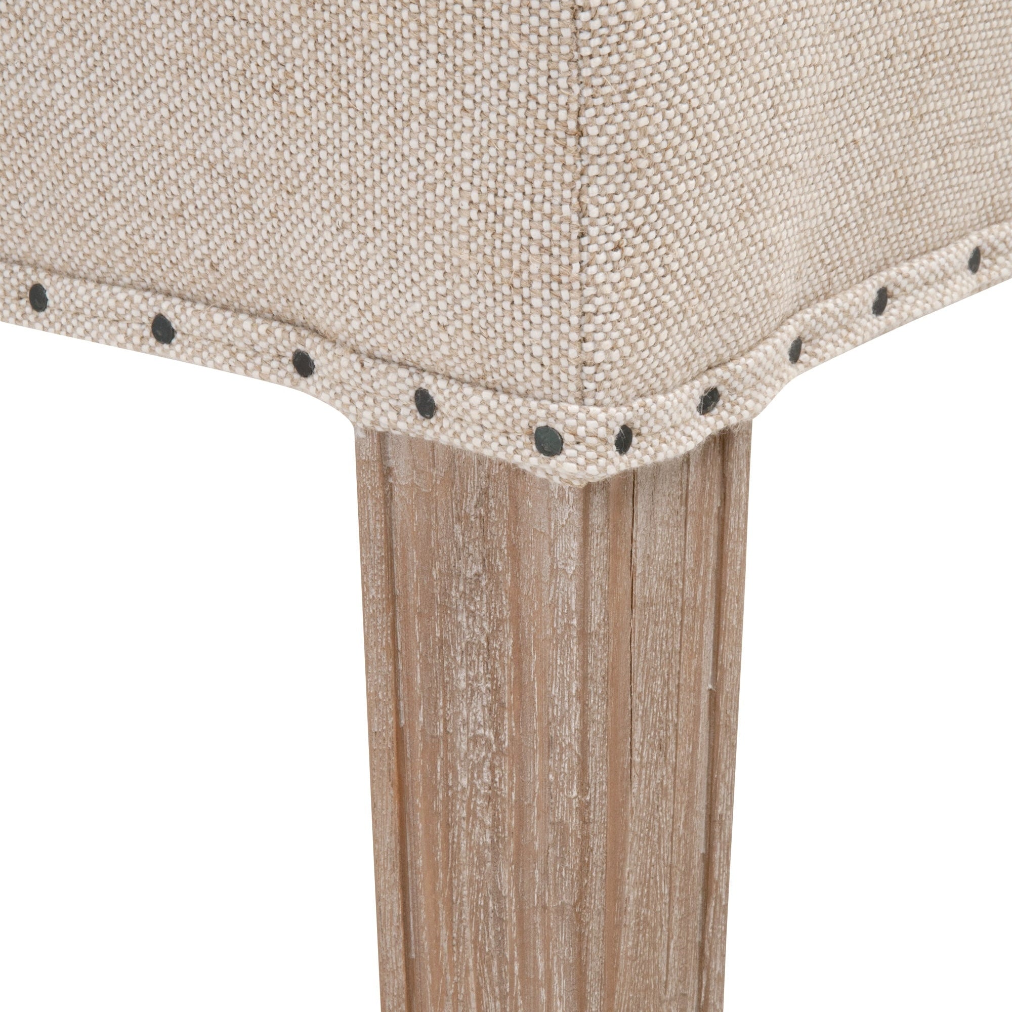 Close-up of Lourdes Dining Chair leg with natural gray ash wood and bisque linen upholstery by Essentials for Living
