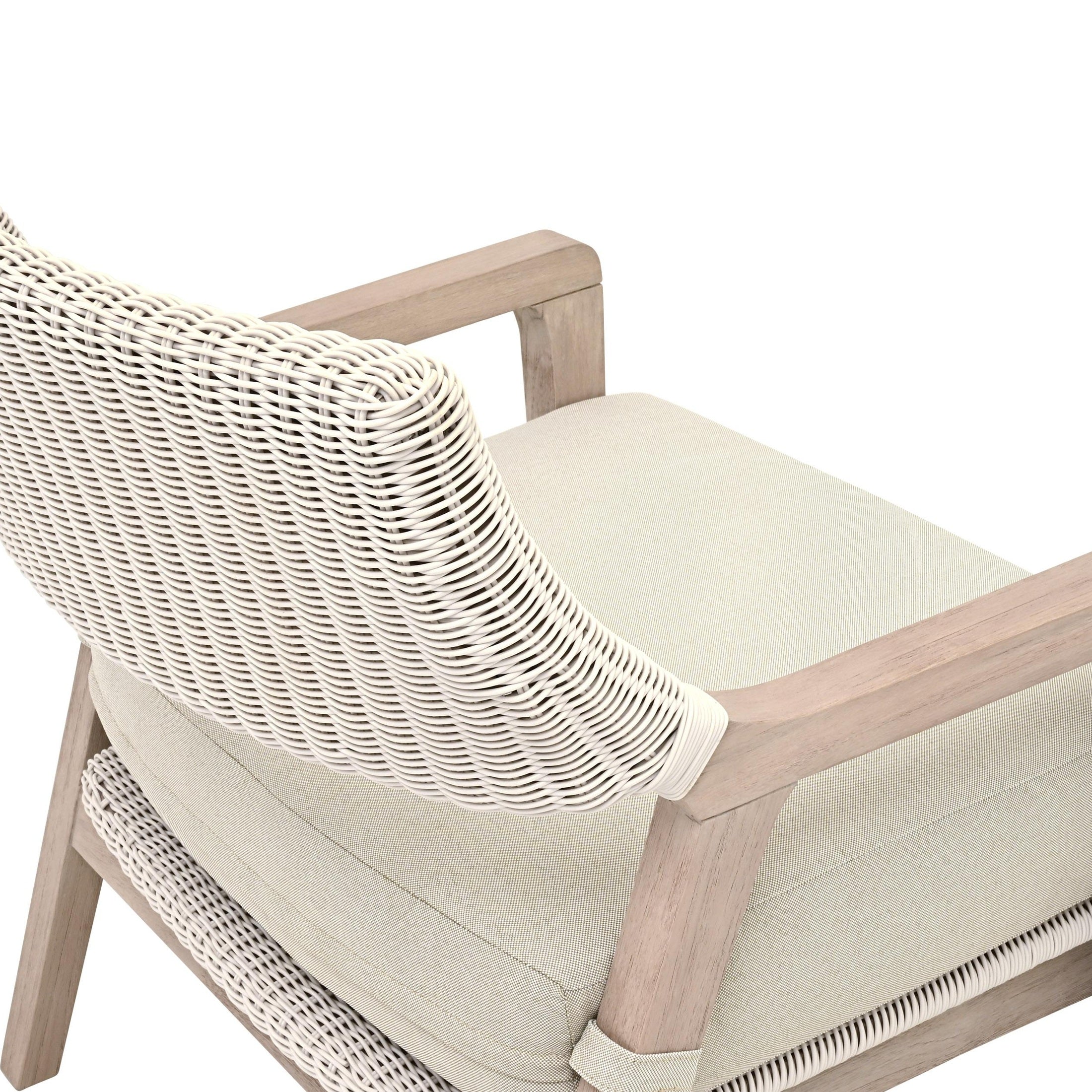 Close-up of Lucia Outdoor Club Chair showing white wicker backrest and stone cushion on washed teak frame by Essentials for Living