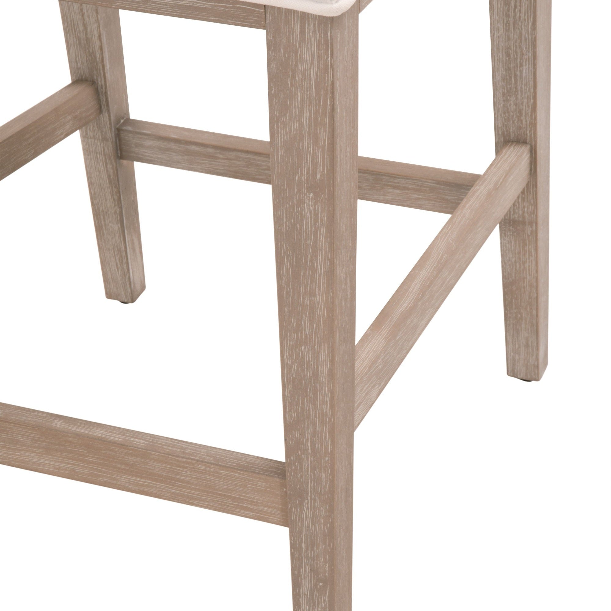 Close-up of natural gray solid rubberwood legs and four-way stretchers on Martin Counter Stool by Essentials For Living