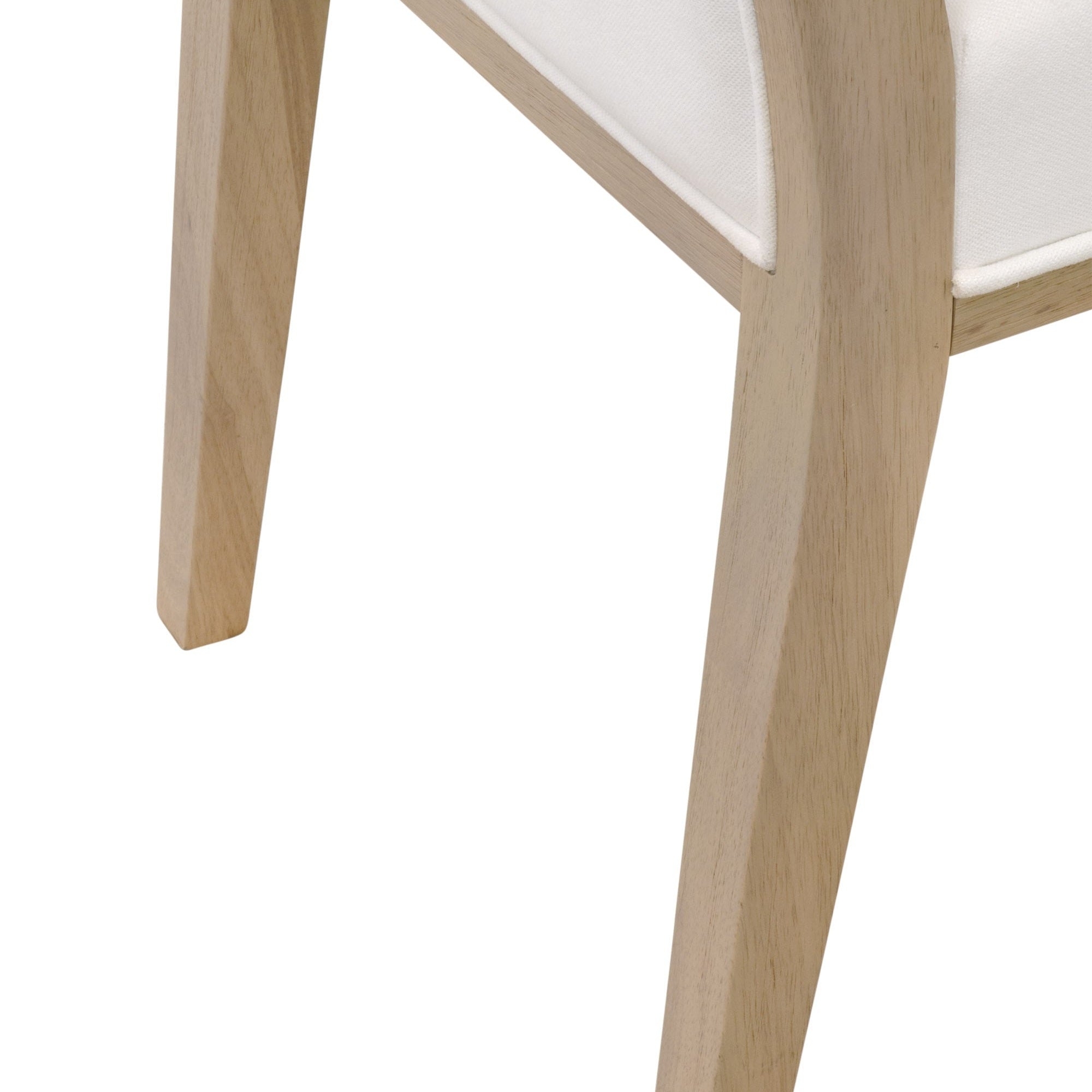 Close-up of natural gray solid rubberwood leg and white upholstered seat of dining chair by Essentials for Living