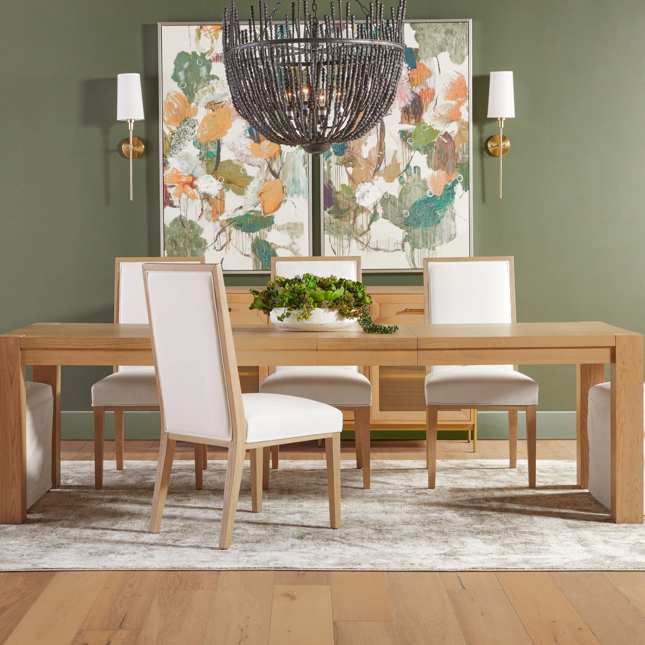 Set of two Essentials for Living Martin Dining Chairs with natural wood frame and white upholstered seats in dining room.
