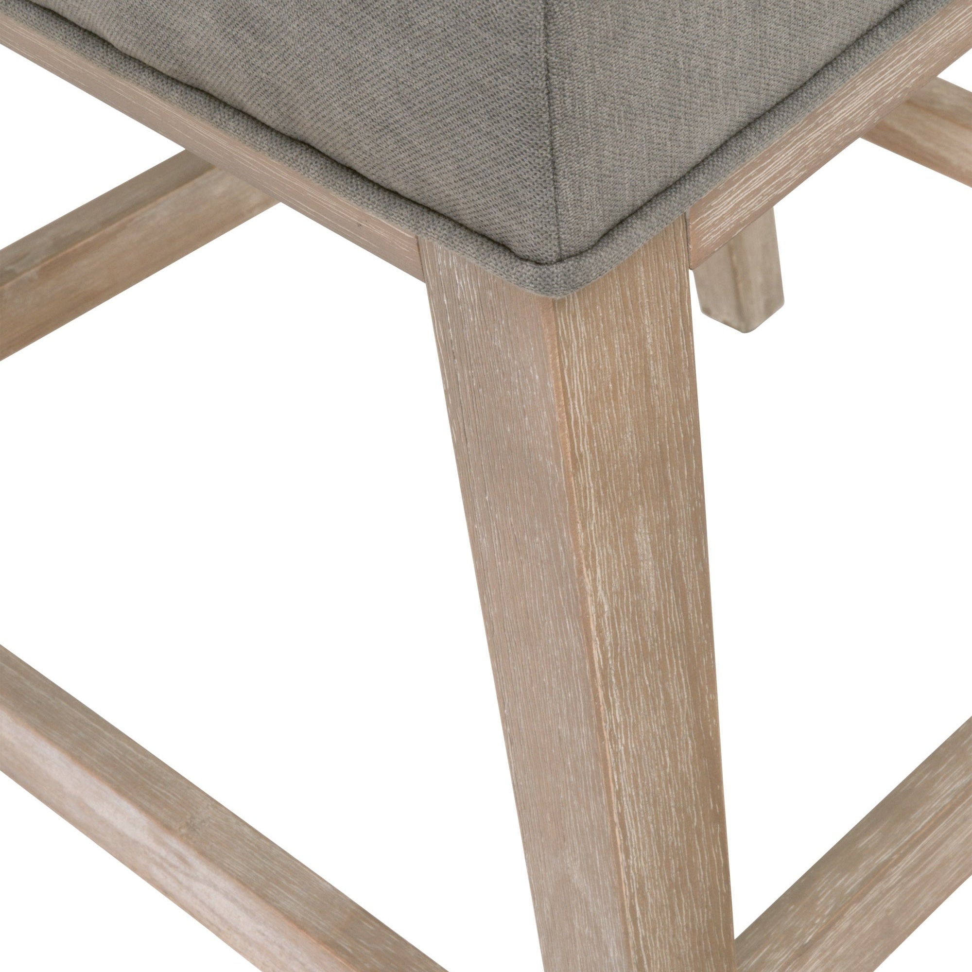 Close-up of Martin Counter Stool leg and slate fabric upholstery with natural gray solid rubberwood frame detailing