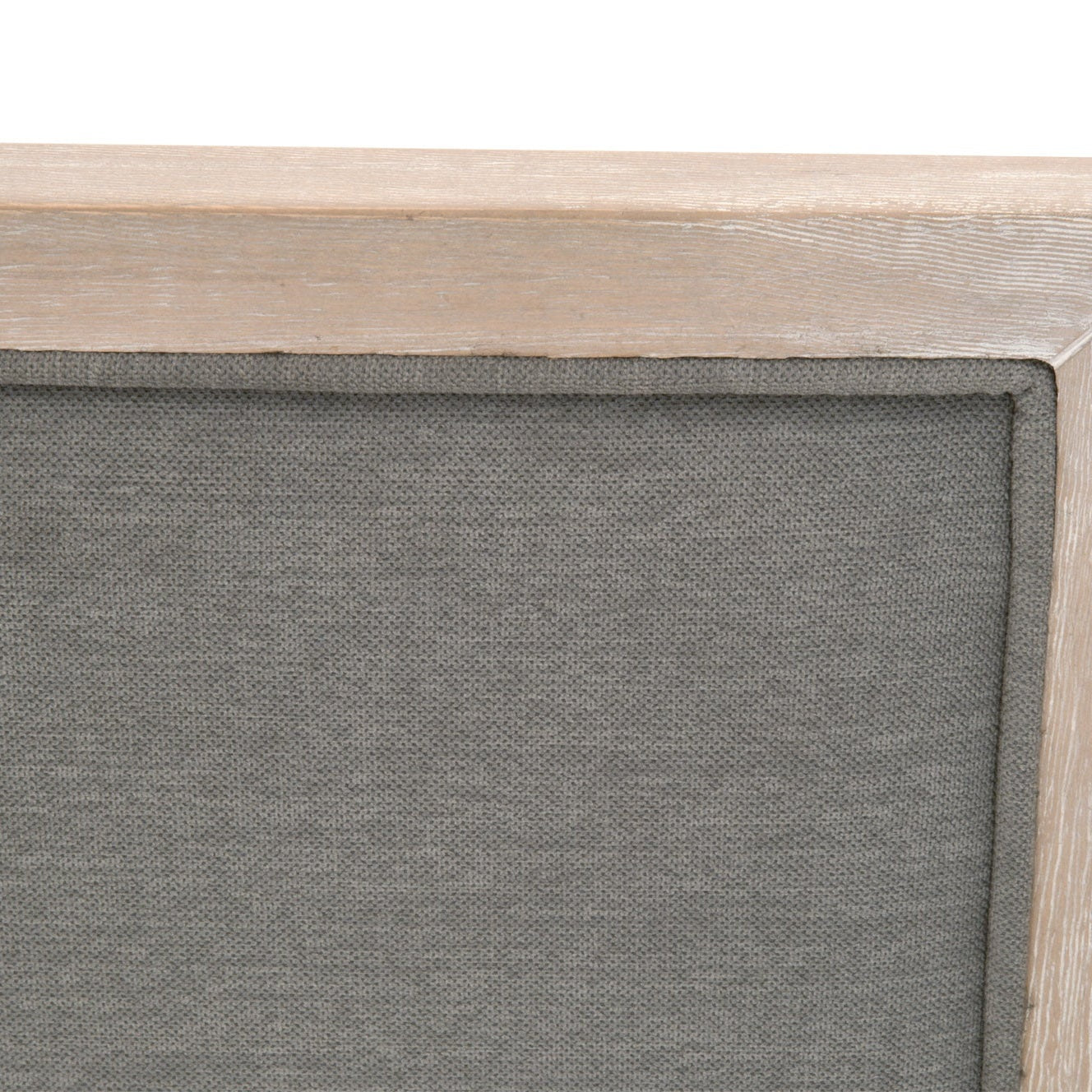 Close-up of Martin Counter Stool’s slate fabric upholstery and natural gray solid rubberwood frame edge by Essentials For Living