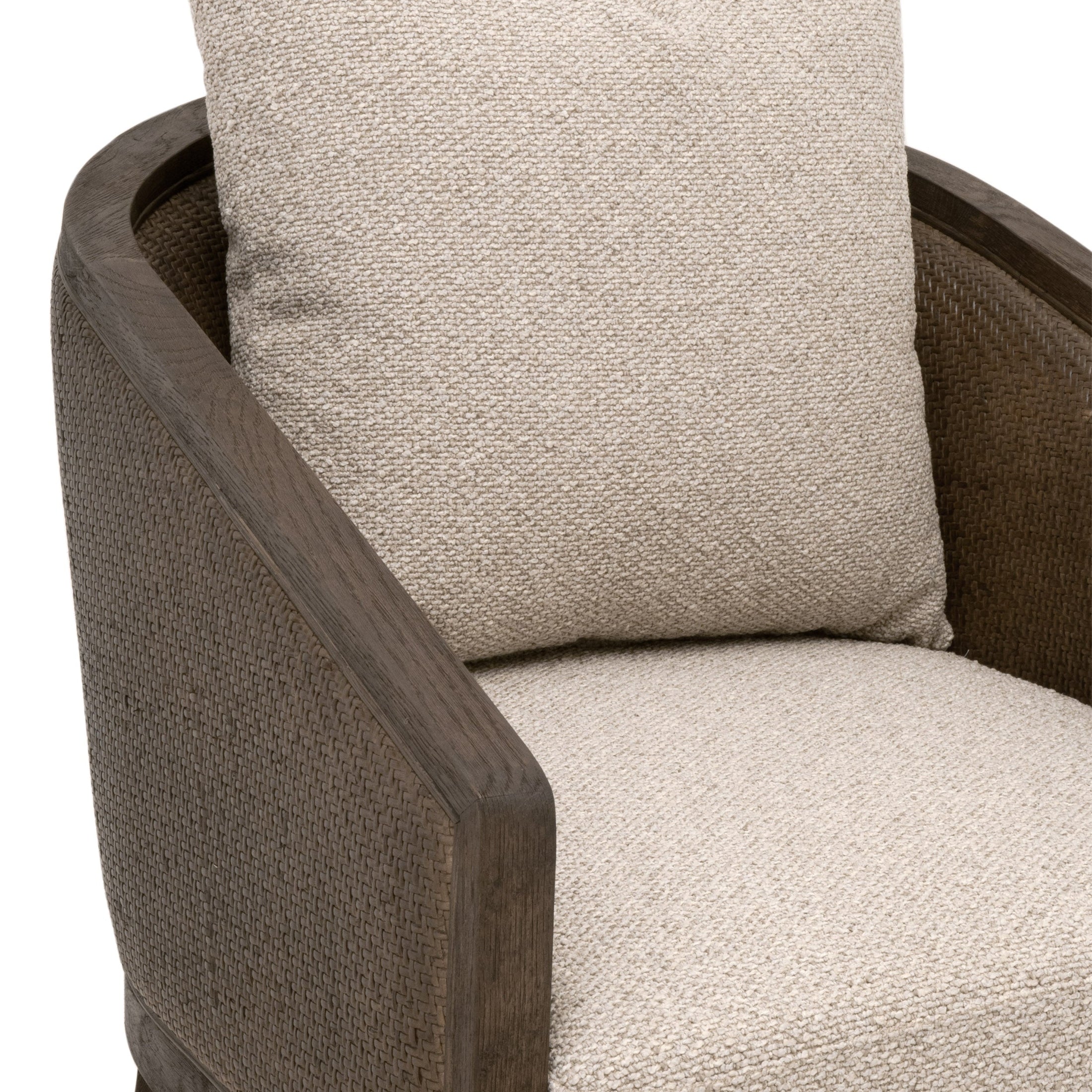 Close-up of Essentials for Living McGuire Arm Chair with beige cushion and dark oak frame wrapped in gray rattan.
