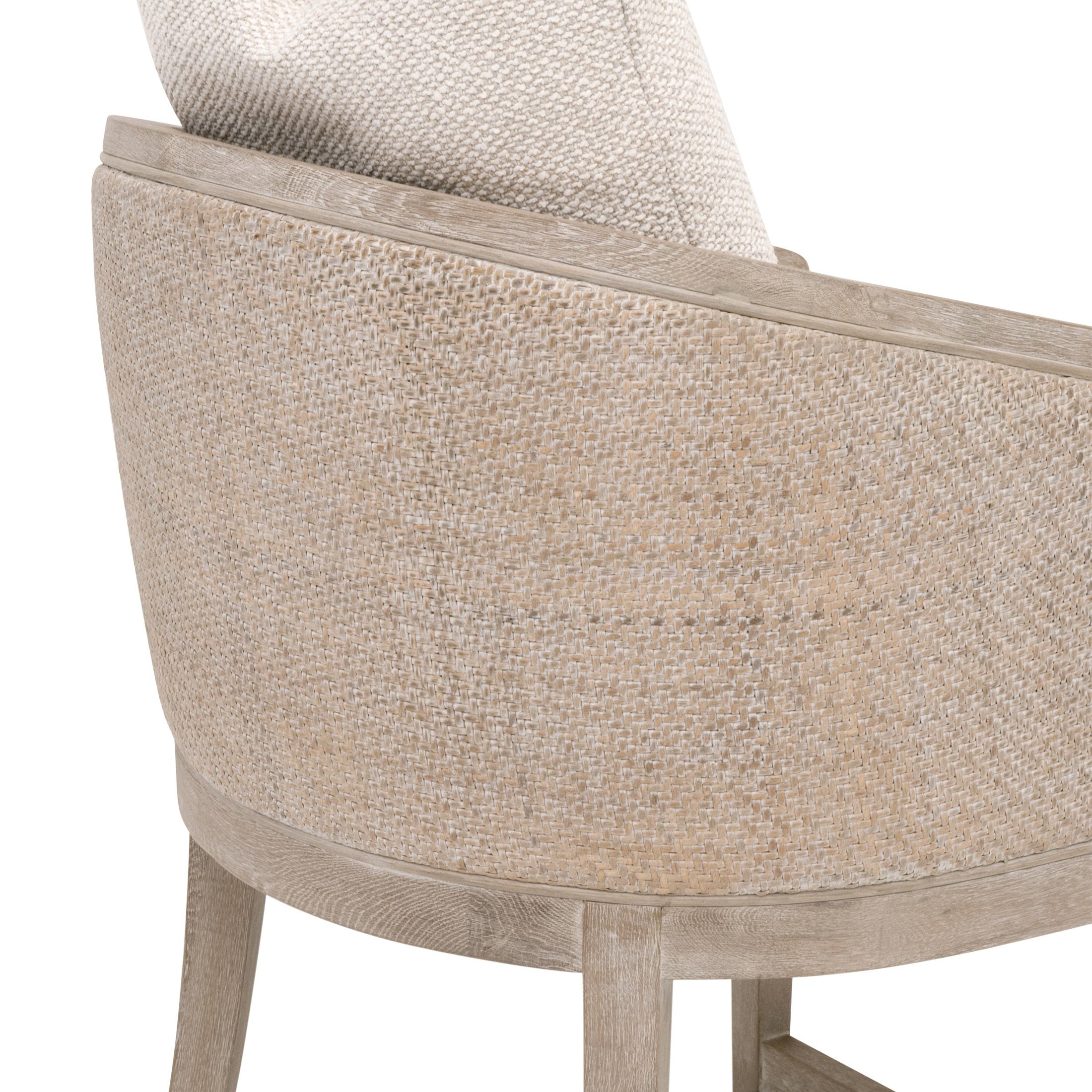 Close-up of natural gray rattan and LiveSmart Gellar-Linen upholstery on McGuire Counter Stool by Essentials for Living