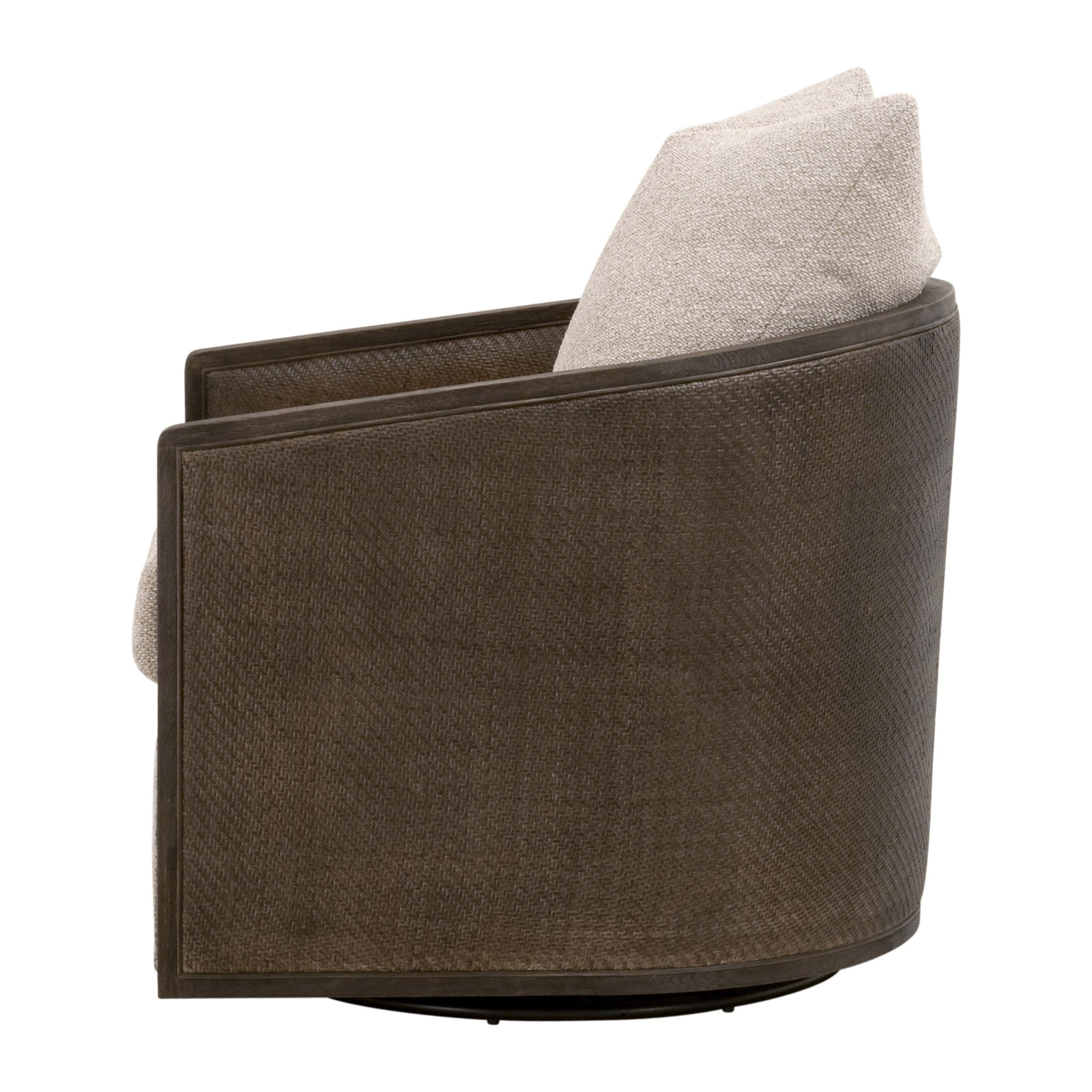 Side view of McGuire swivel club chair with dark woven cane frame and light fabric cushion by Essentials for Living