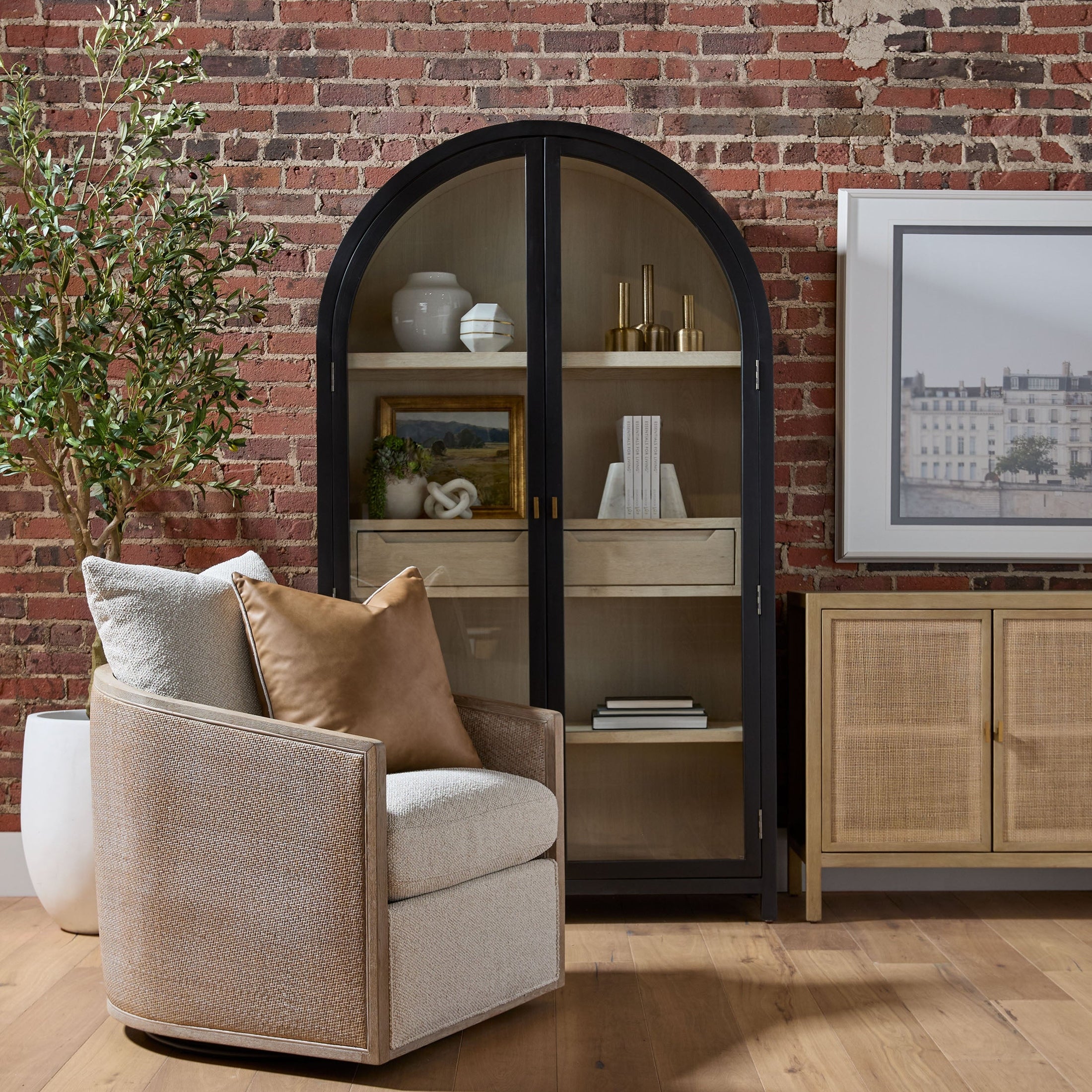 Essentials for Living McGuire Swivel Club Chair with gray cane frame and Snow Boucle upholstery in a cozy living space