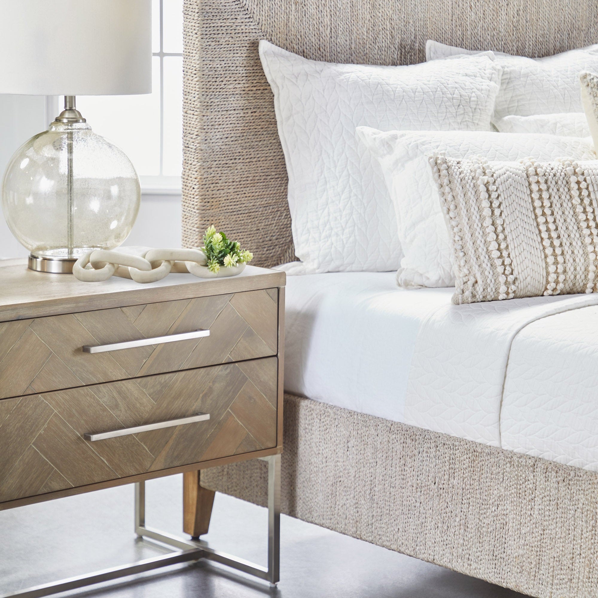 Mosaic 2-Drawer Nightstand with herringbone acacia veneer, stainless steel base, next to bed Essentials for Living