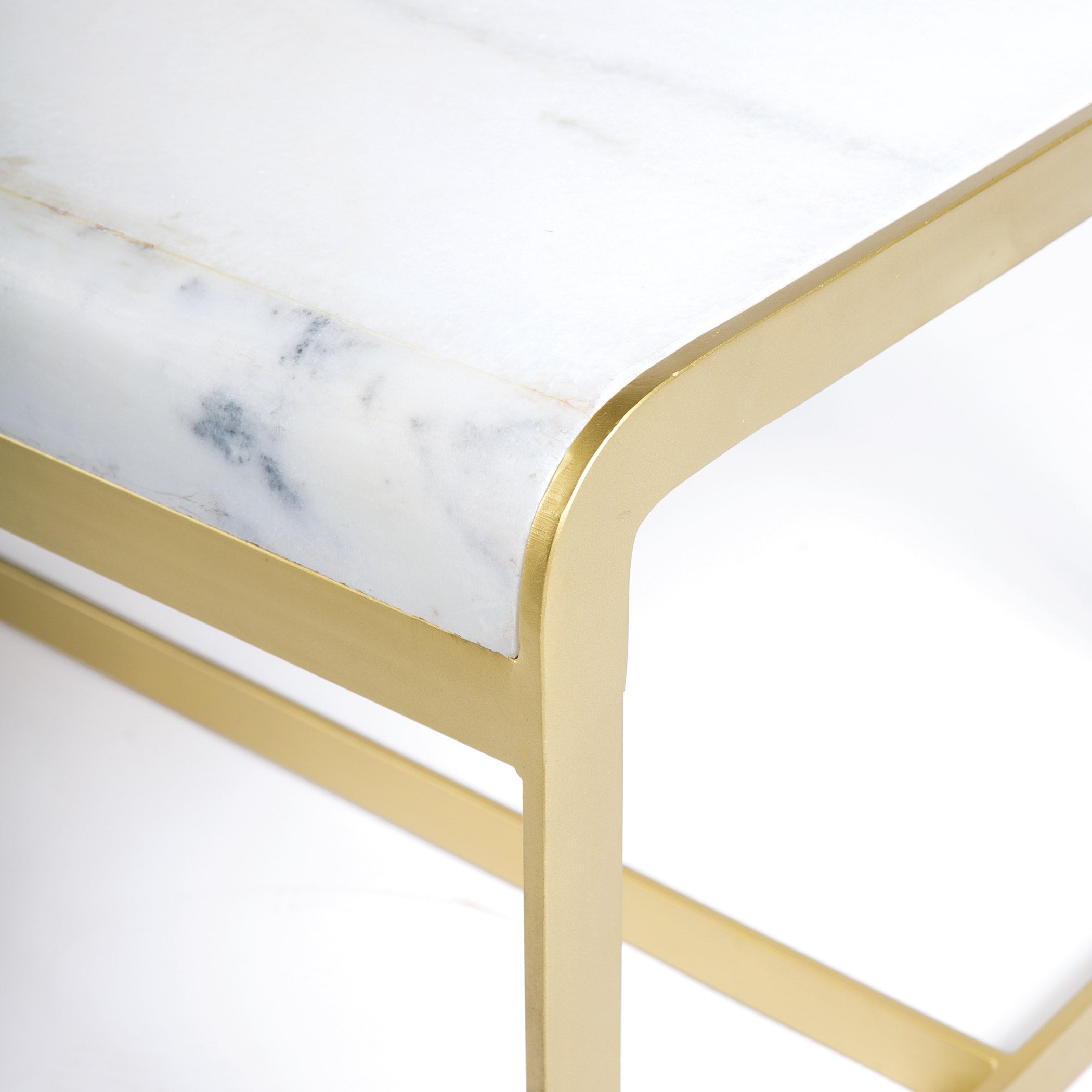 Close-up of New York Coffee Table with rounded white marble top and sculptural gold iron base by GO HOME