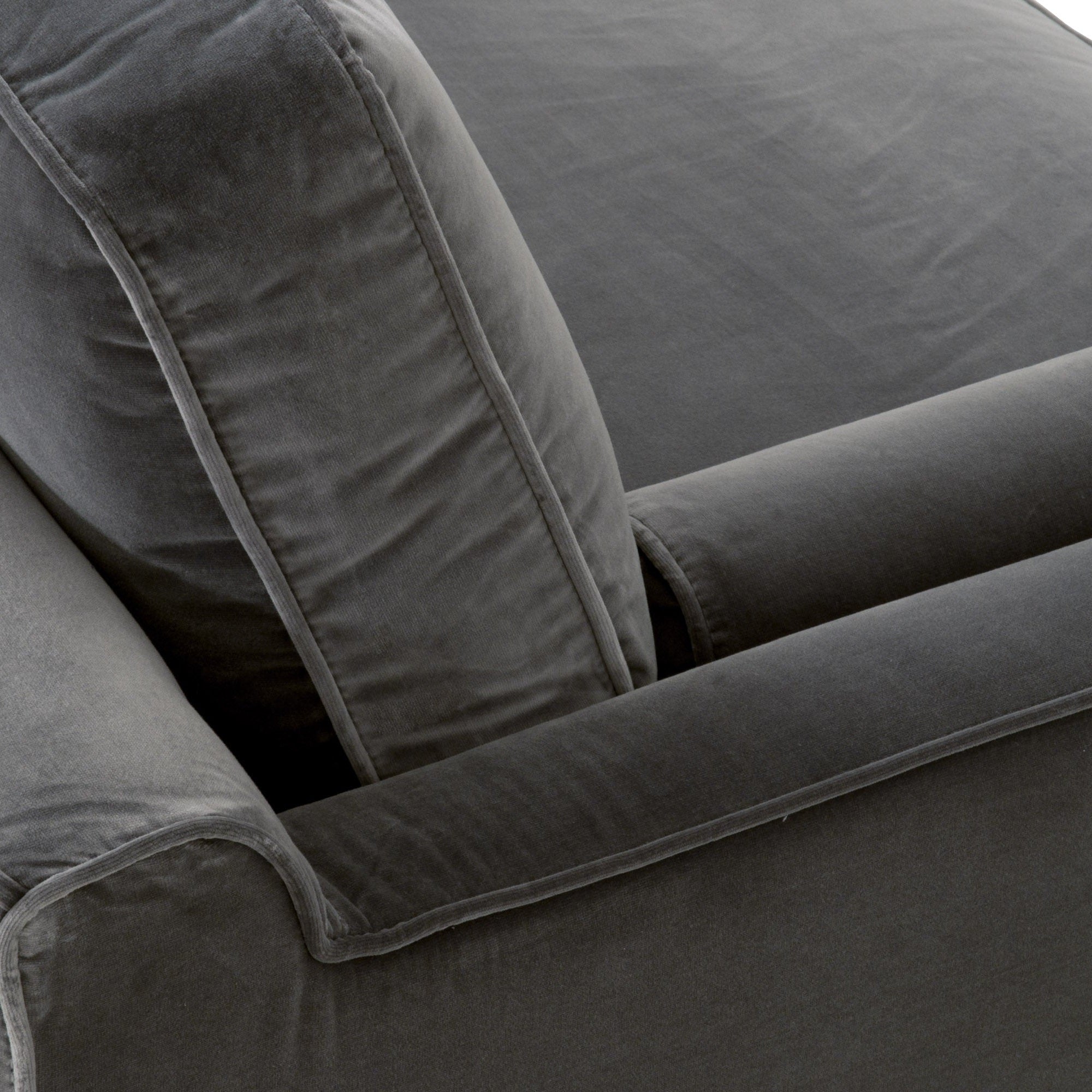 Close-up of plush velvet upholstery and tailored stitching on the Essentials For Living Parker 86 Post Modern Sofa cushion and armrest