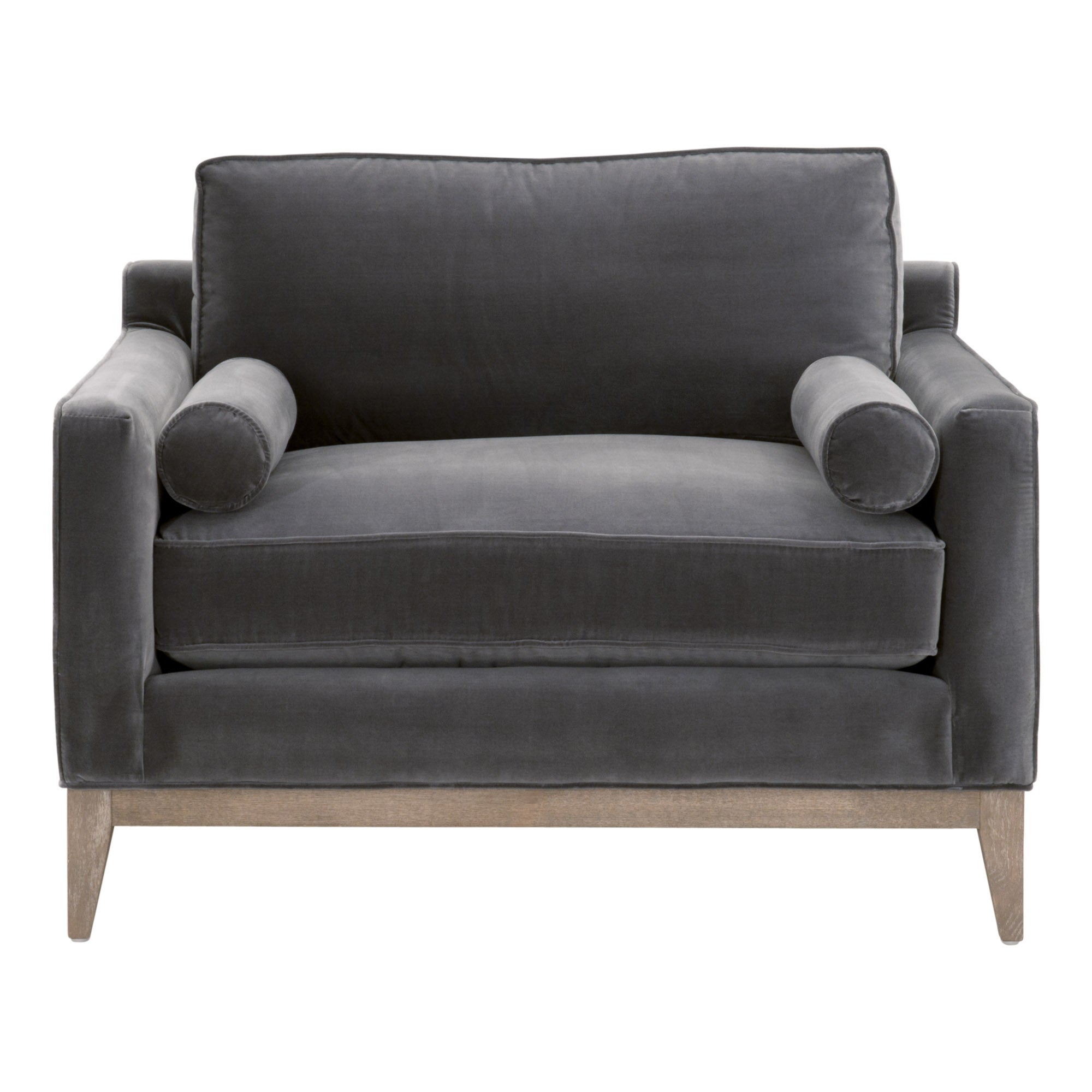 Essentials For Living sofa chair in plush gray velvet with exposed natural wood base and cylindrical bolster pillows