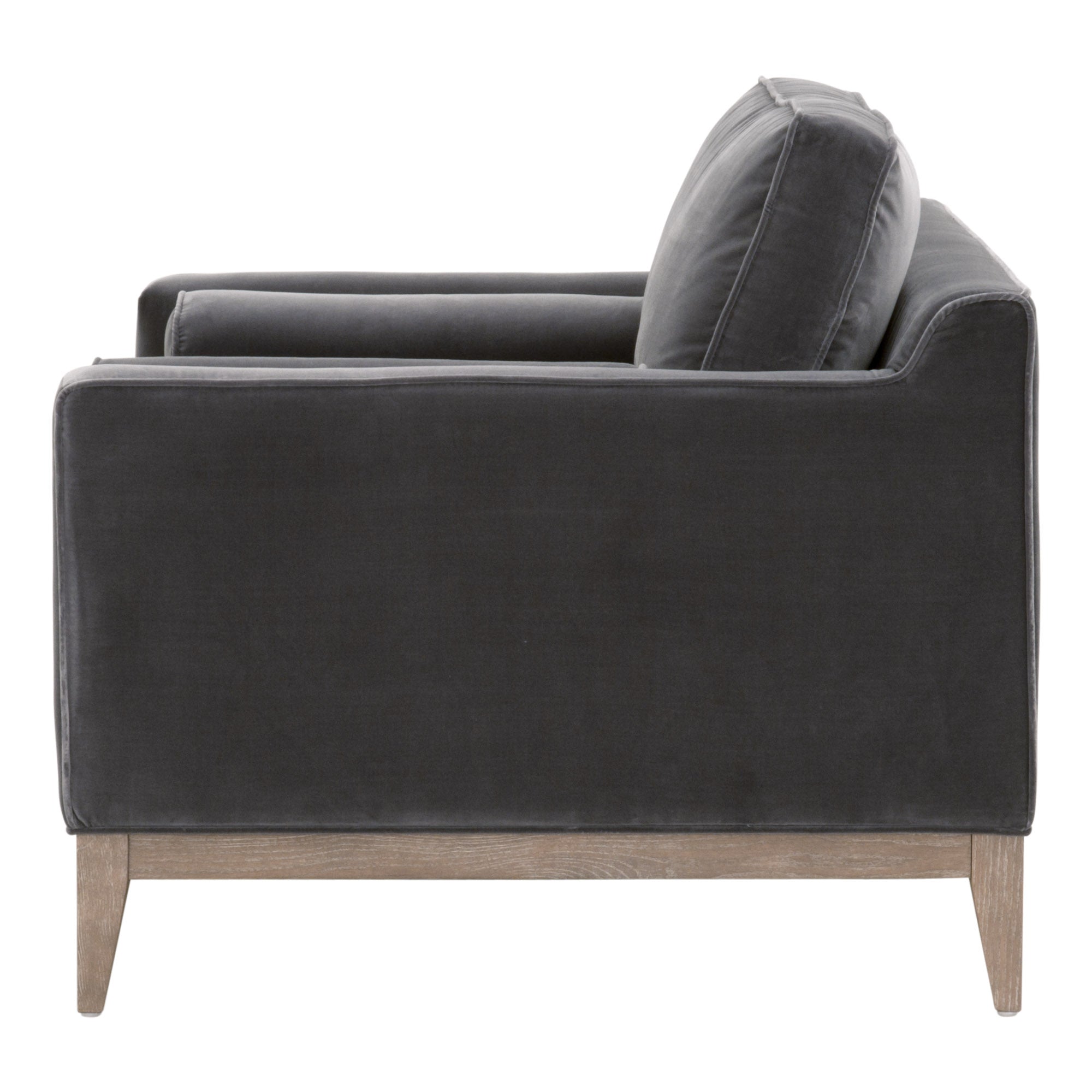Side view of a modern charcoal velvet sofa chair with natural gray oak legs by Essentials For Living