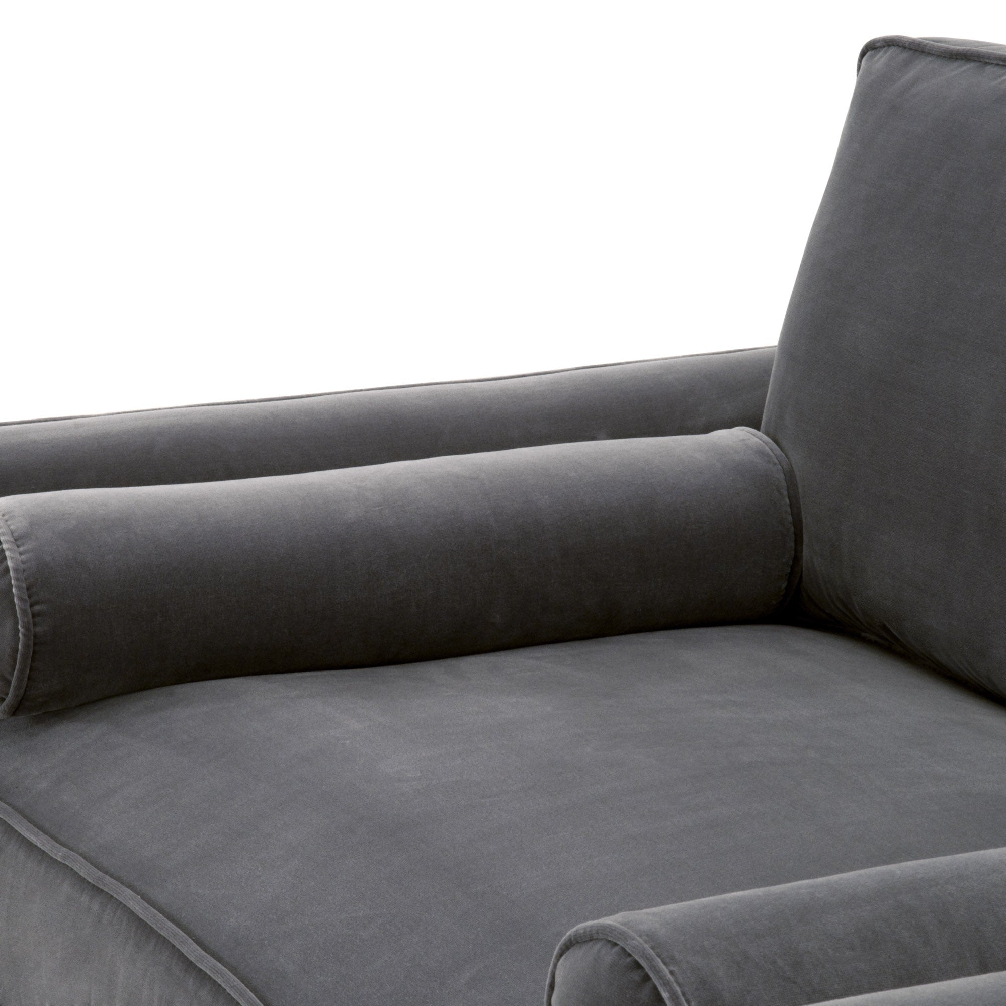 Close-up of a dark gray velvet sofa chair cushion and cylindrical bolster pillow by Essentials For Living