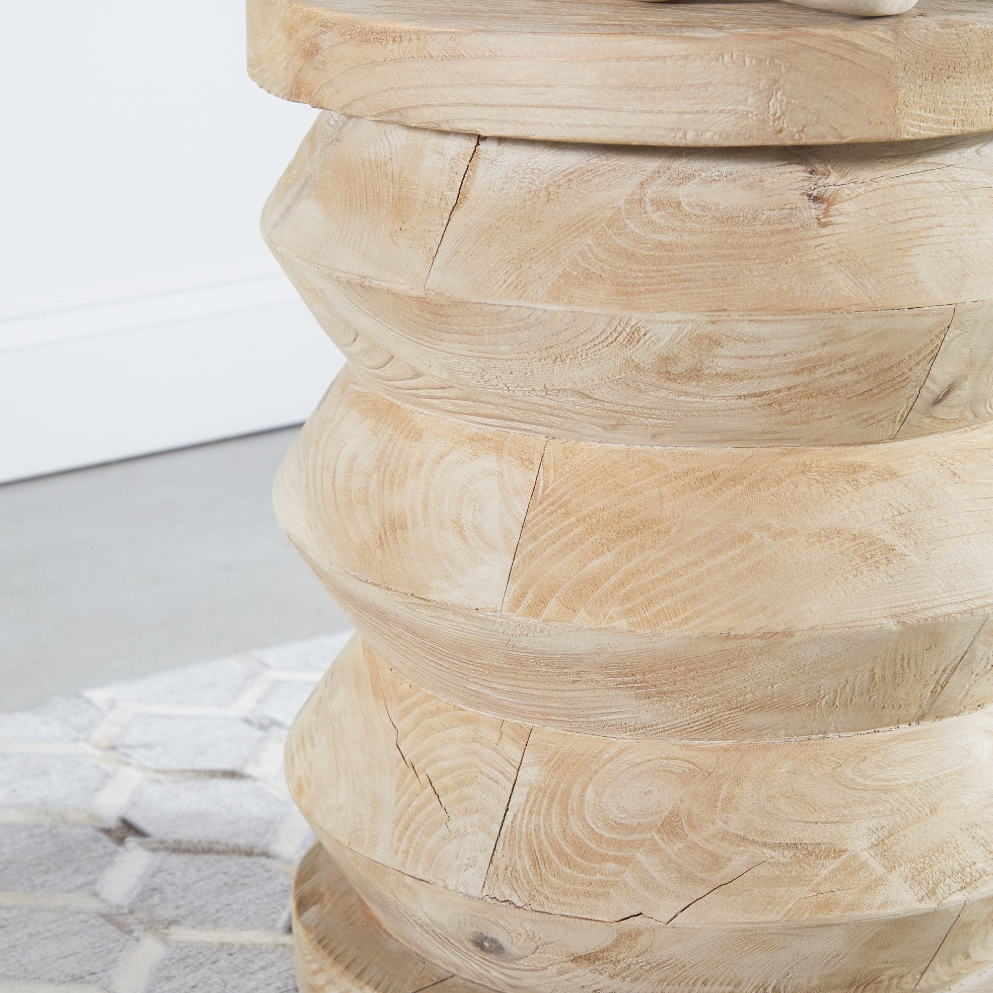 Close-up of reclaimed pine wood grain on cylindrical Pier Accent Table by Essentials For Living with natural texture details